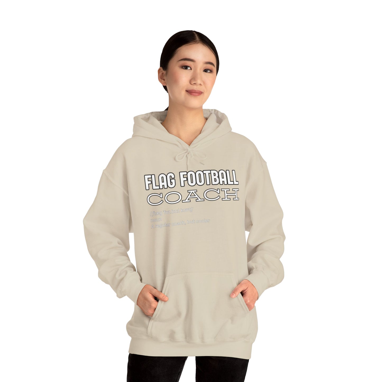 Asian female model in front-view sand Flag Football Coach hoodie, hands in kangaroo pocket, coach vibes