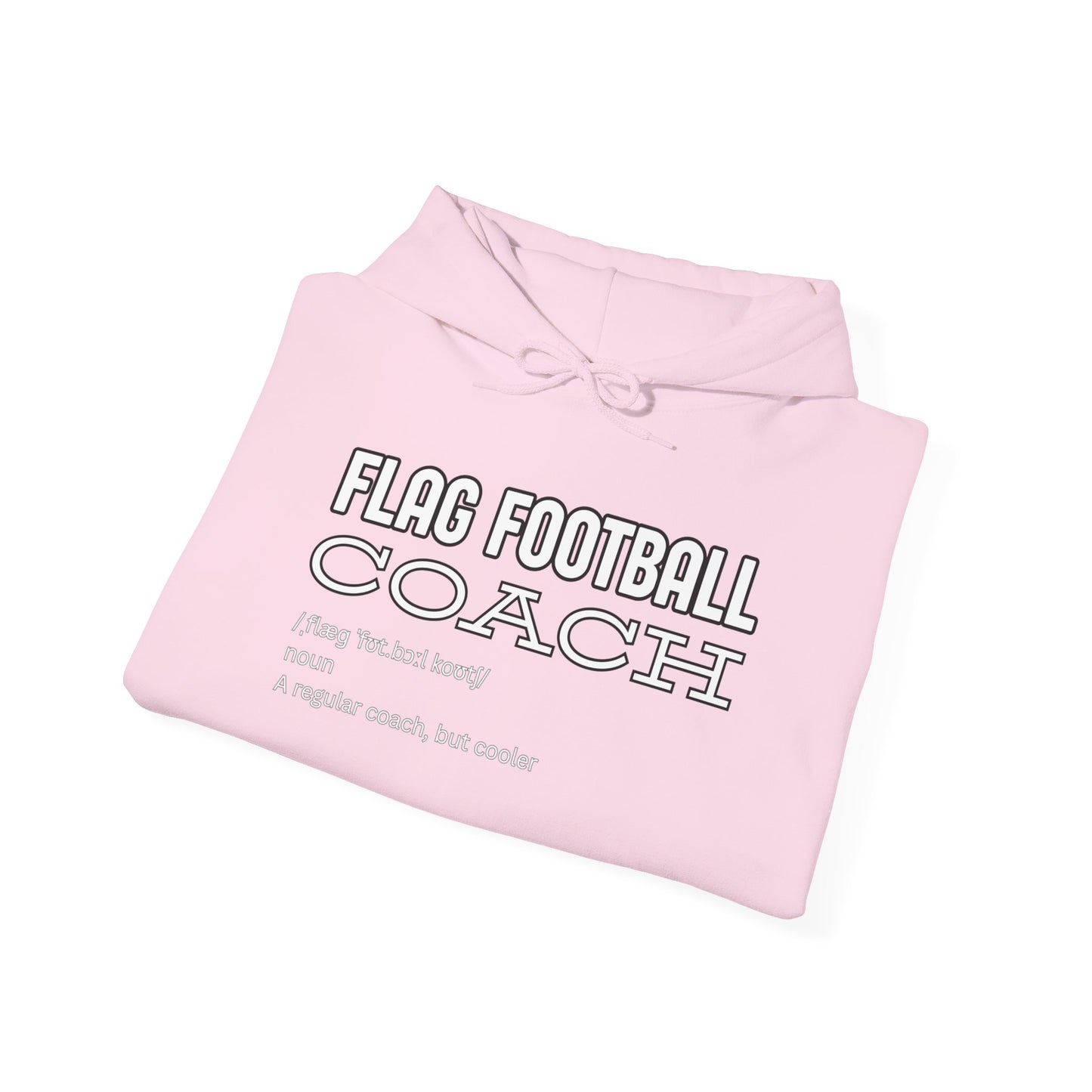 Folded light pink hoodie revealing black front print: "FLAG FOOTBALL COACH (flag foot coach) noun: A regular coach, but cooler"
