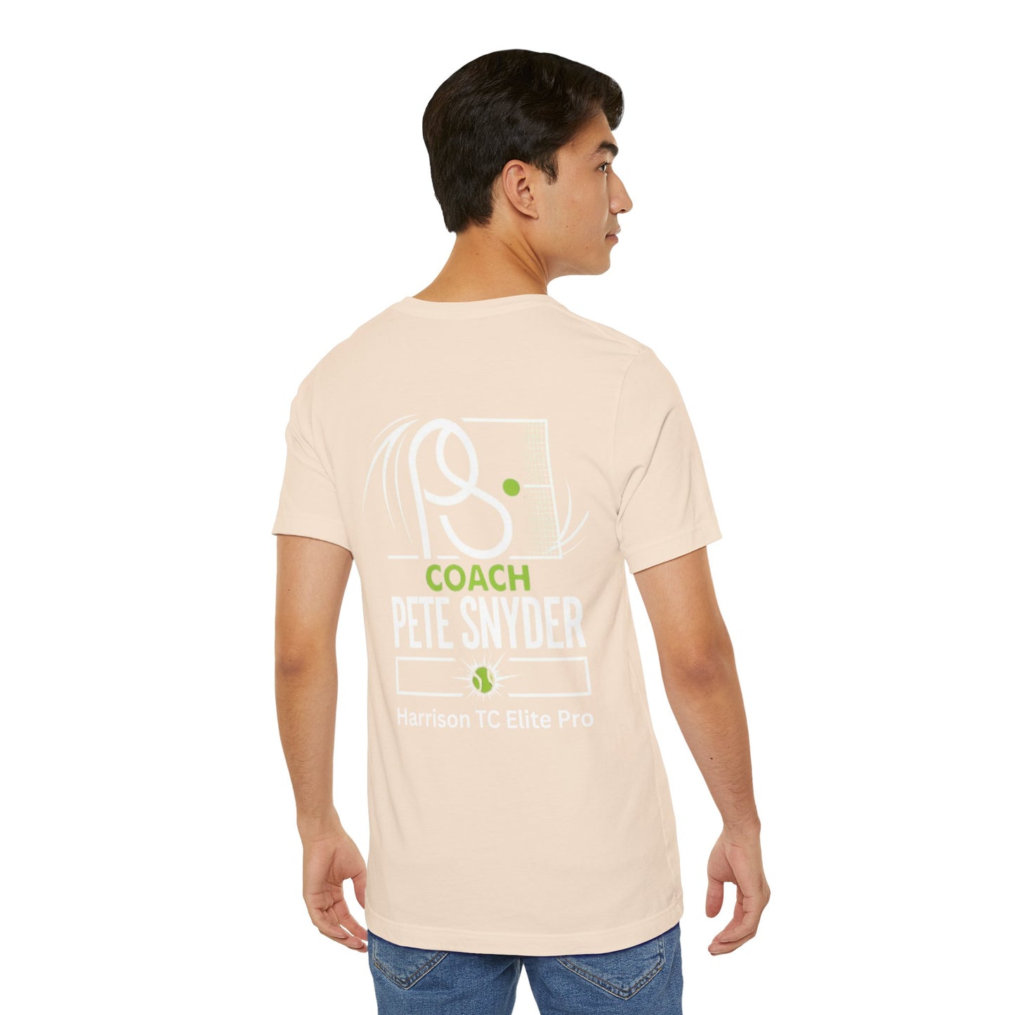 Side profile male model in beige Coach Pete Snyder tee showing back "COACH PETE SNYDER" graphic and jeans