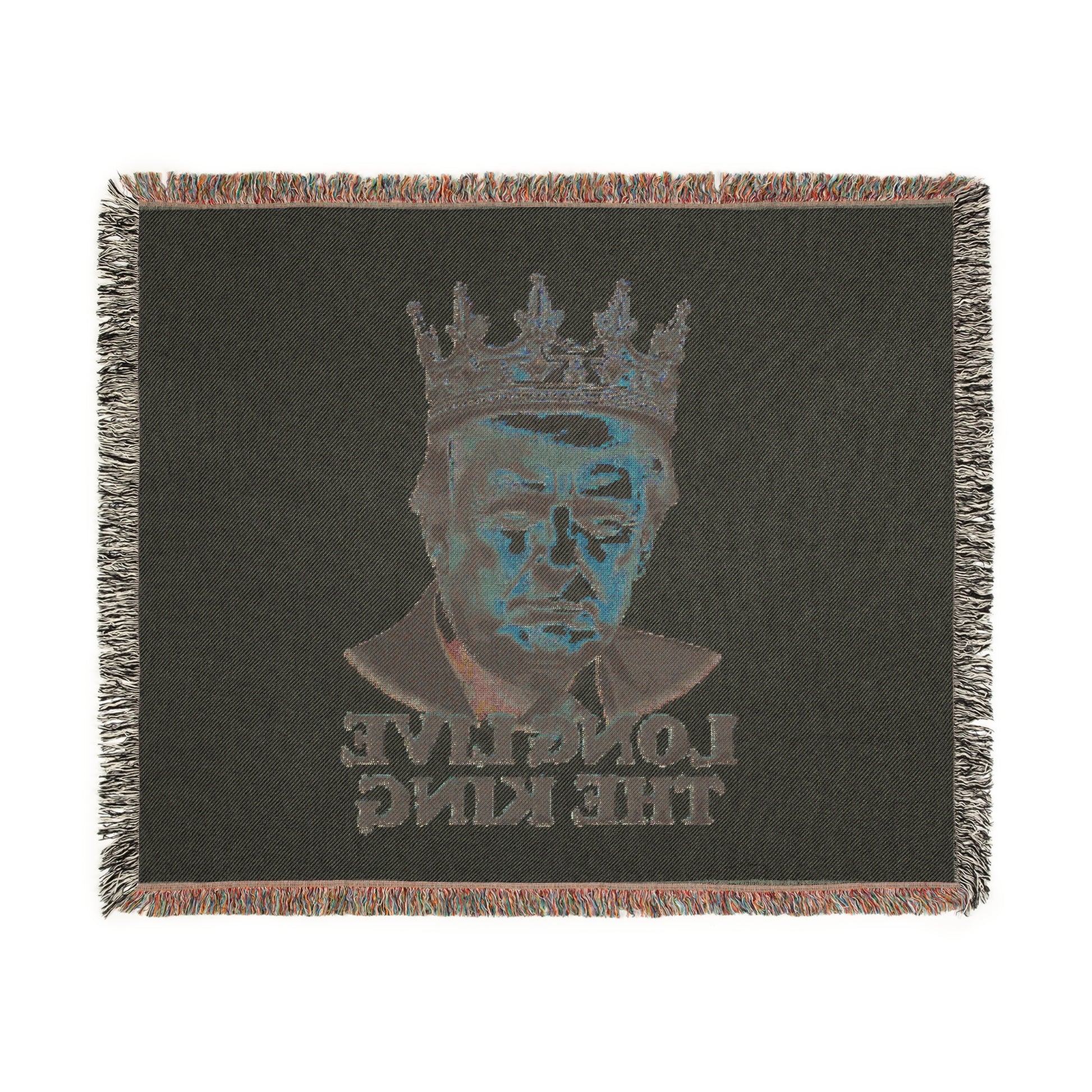 Backside of black woven blanket: stylized blue Trump under crown, inverted mirrored text 'LONG LIVE THE KING', fringed edges