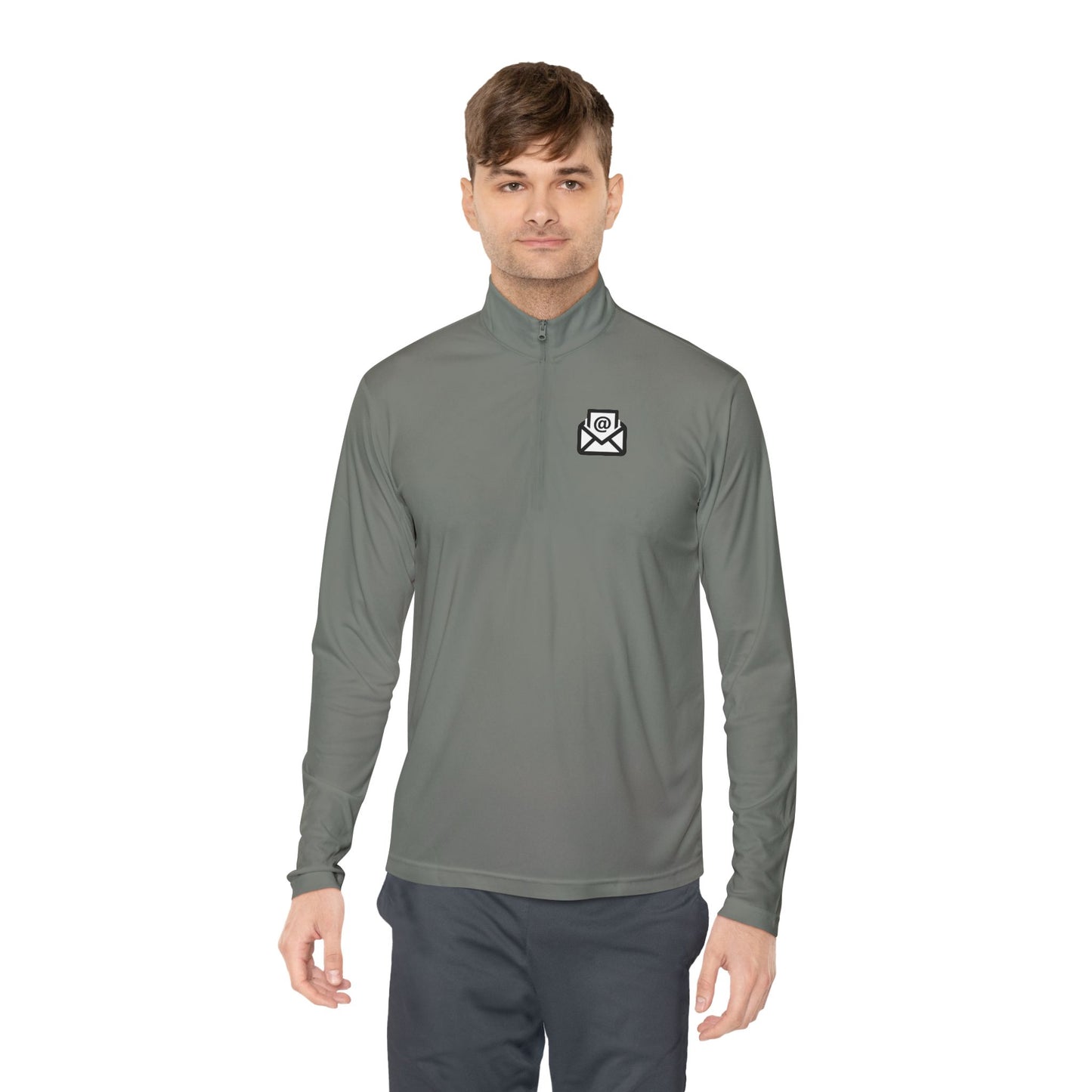 Smiling man in medium grey quarter-zip pullover front view, white envelope logo left chest, grey pants