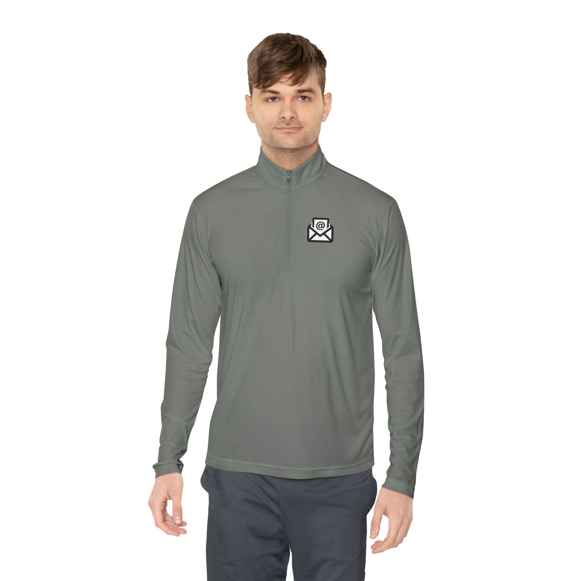 Smiling man in medium grey quarter-zip pullover front view, white envelope logo left chest, grey pants