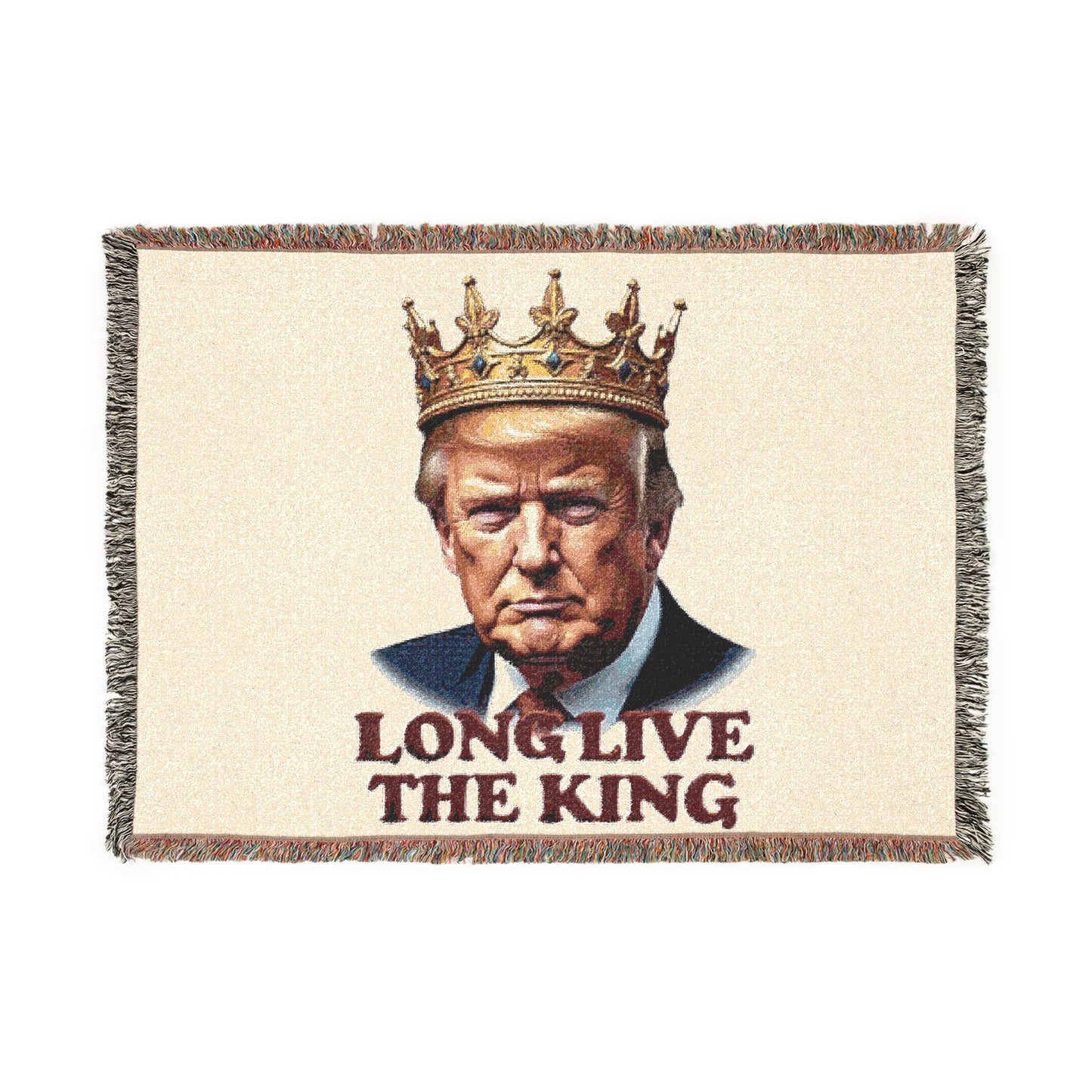 Front view of cream woven blanket with crowned Trump portrait, gold crown, blue suit details, 'LONG LIVE THE KING' text, colorful fringed edges