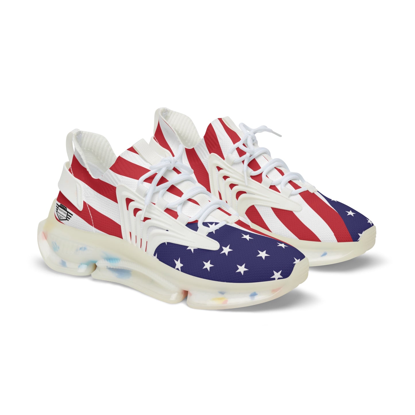 Angled front view of USA flag mesh sneakers pair, red-white-blue stars & stripes upper, white laces, translucent chunky sole