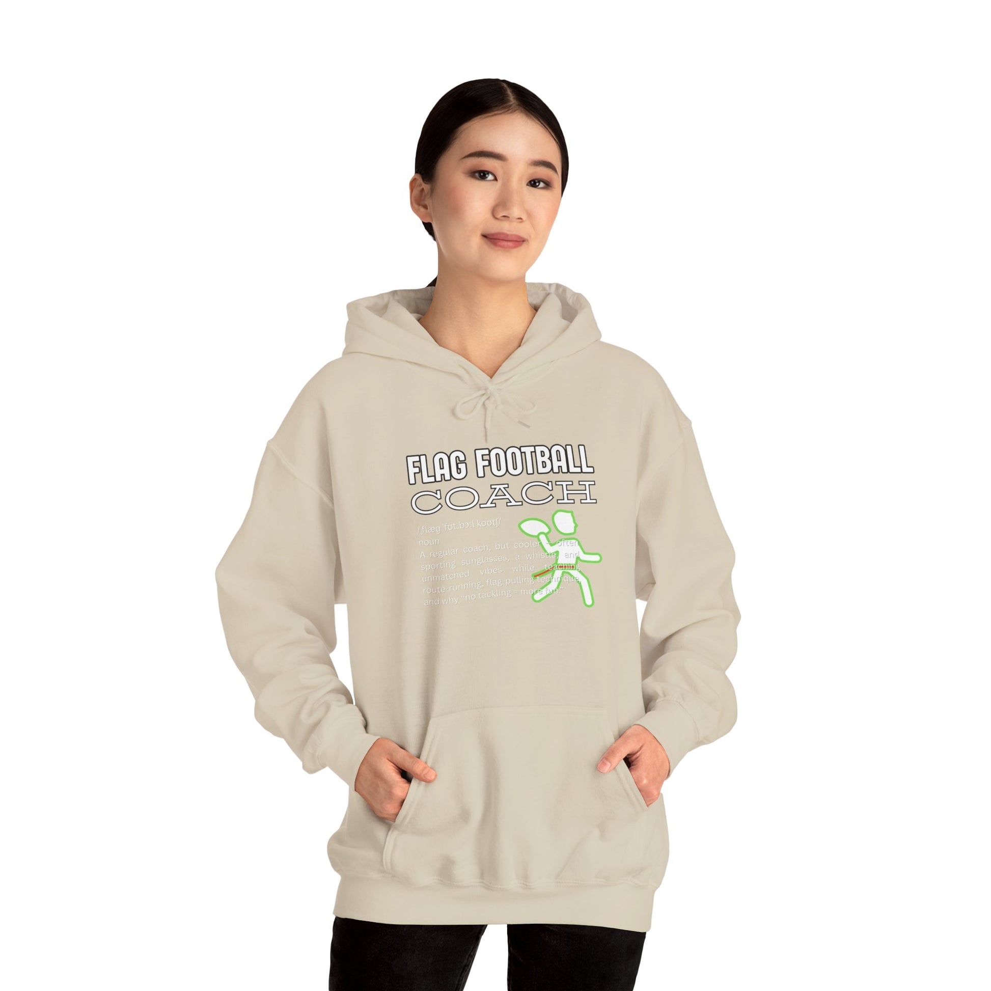 Asian female model in light beige Flag Football Coach hoodie, hands in pockets, neon accents pop