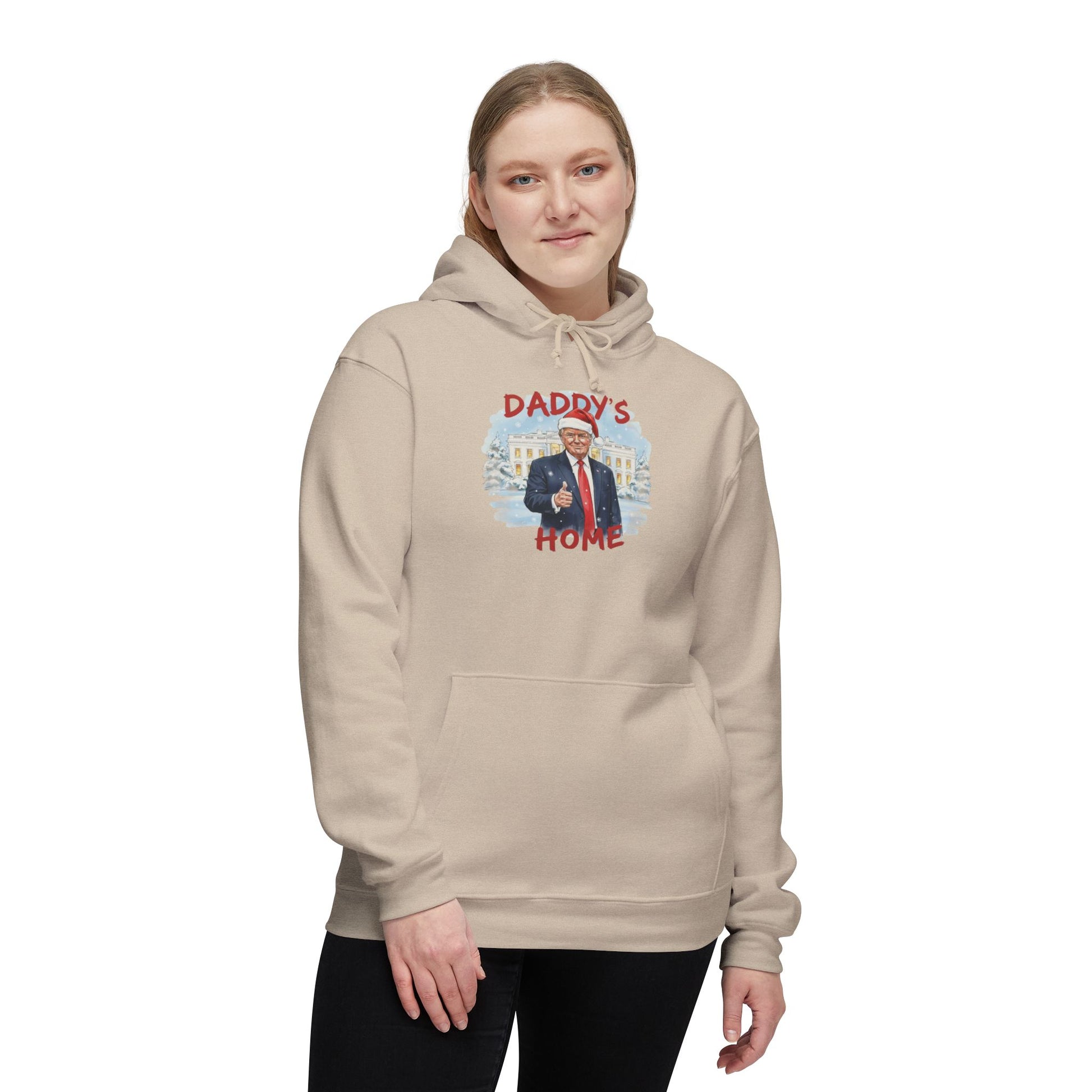 Woman wearing front of cream Trump "Daddy's Home" Christmas hoodie with festive Trump portrait
