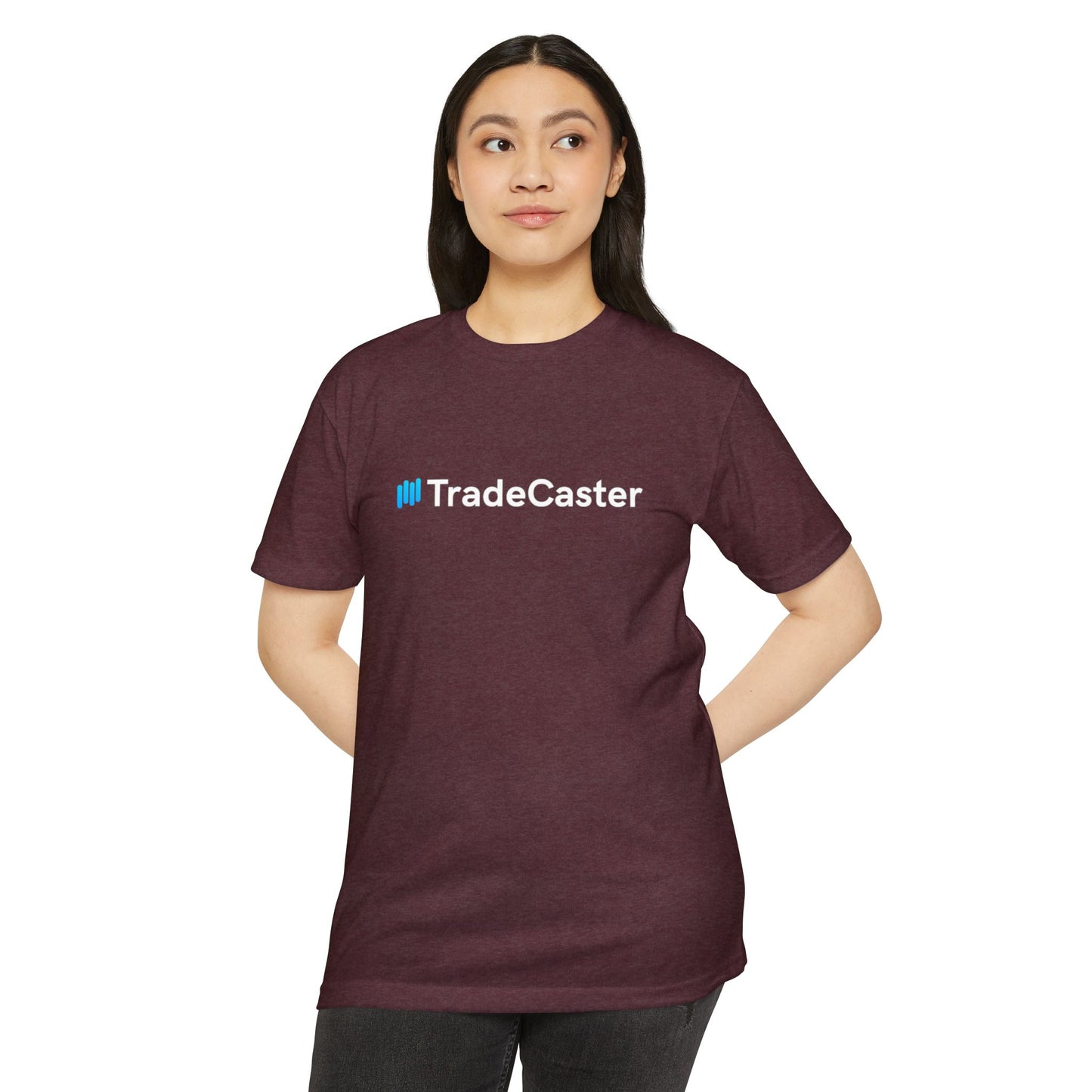 Female model front view wearing maroon heather unisex TradeCaster tee, hands on hips showing blue logo