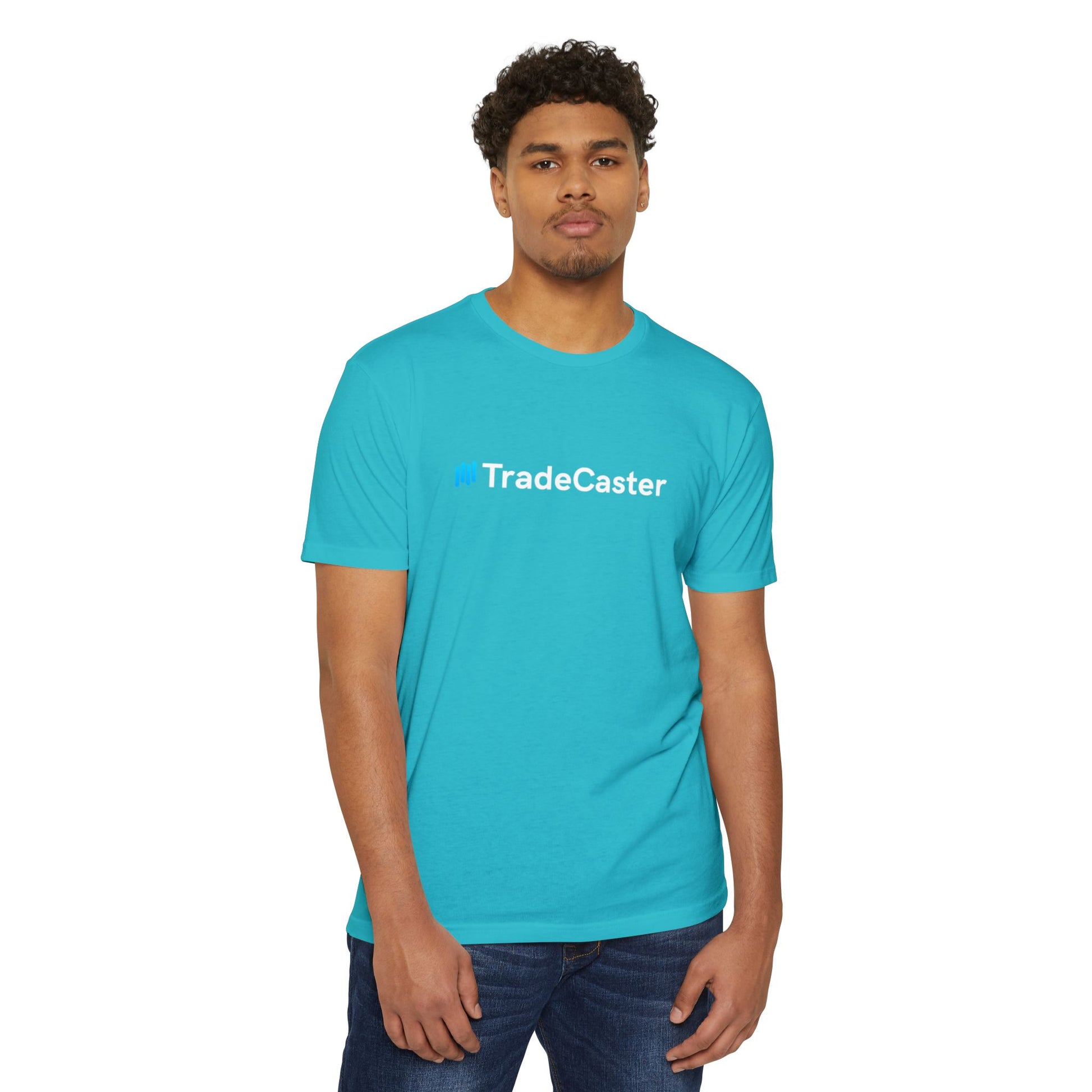 Male model in turquoise TradeCaster tee front view, blue logo white text, relaxed jeans stance