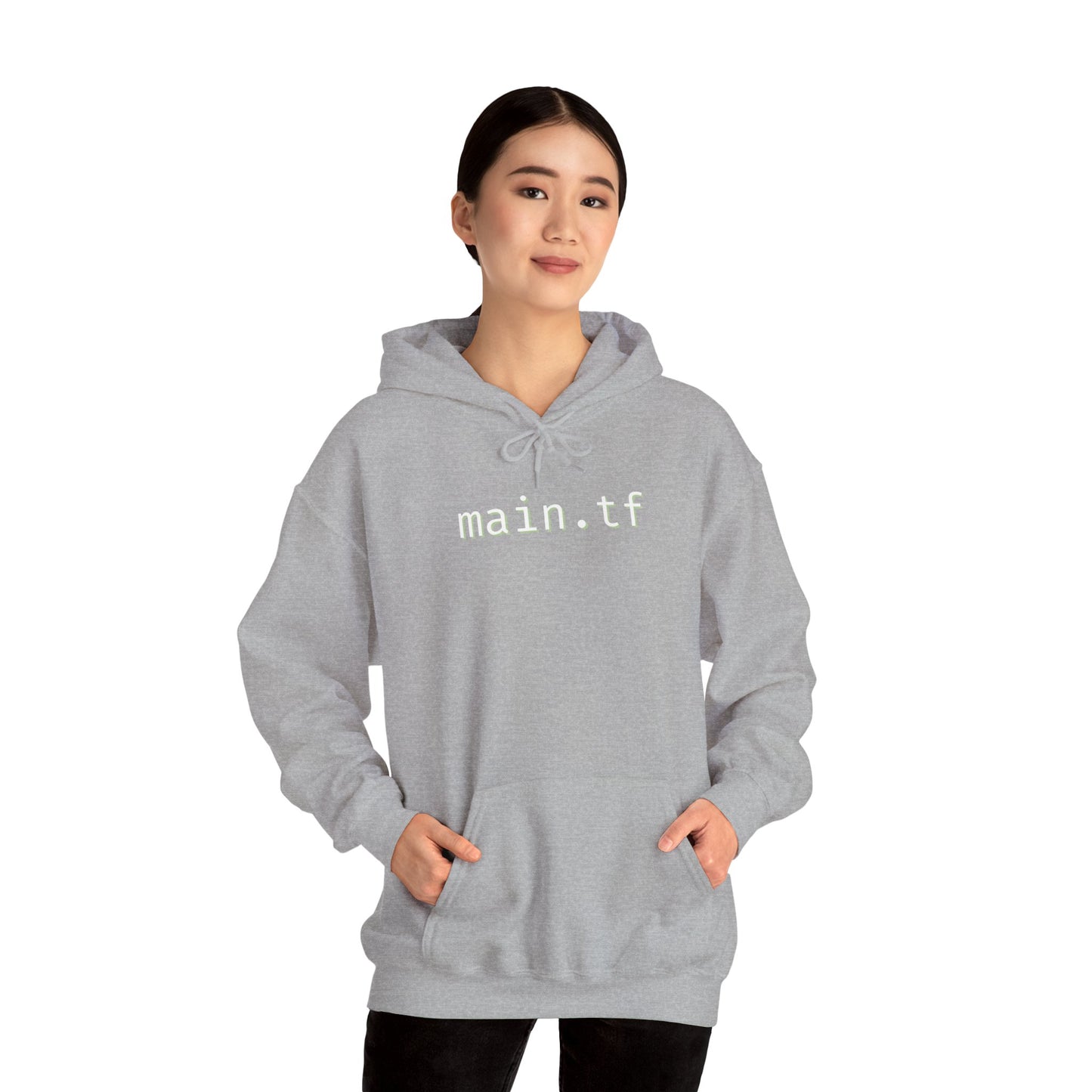 Asian model owning light grey main.tf hoodie front, hands in pockets, casual black pants