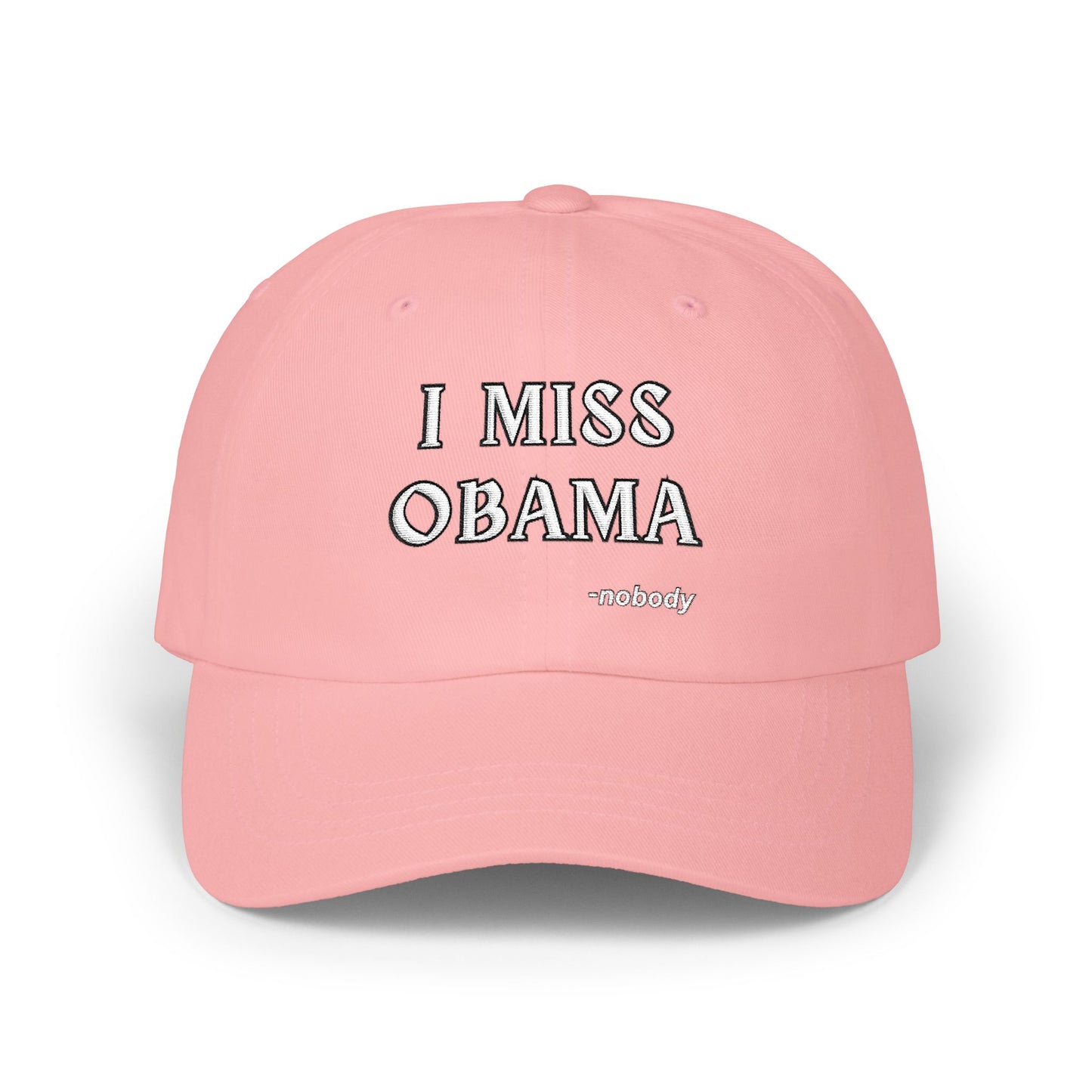 Front view of pink dad hat with playful white "I MISS OBAMA -nobody" embroidery