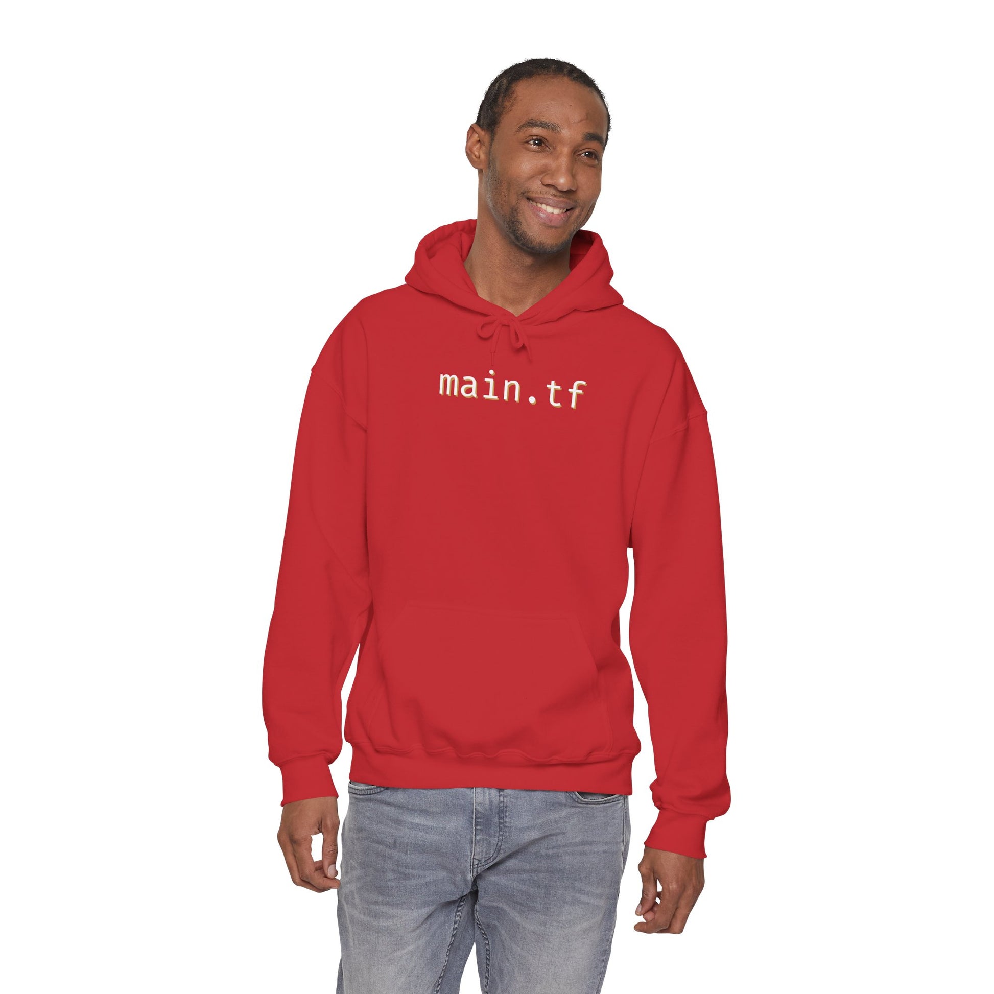 Smiling model owning the red pullover with crisp white "main.tf" front print, casual jeans vibe