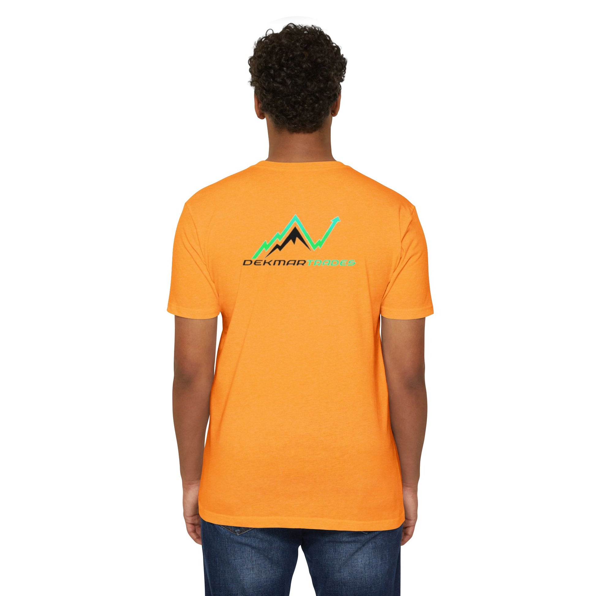 Male model back view in orange CVC t-shirt showing "Dekmar Trades" chart design, easy jeans fit