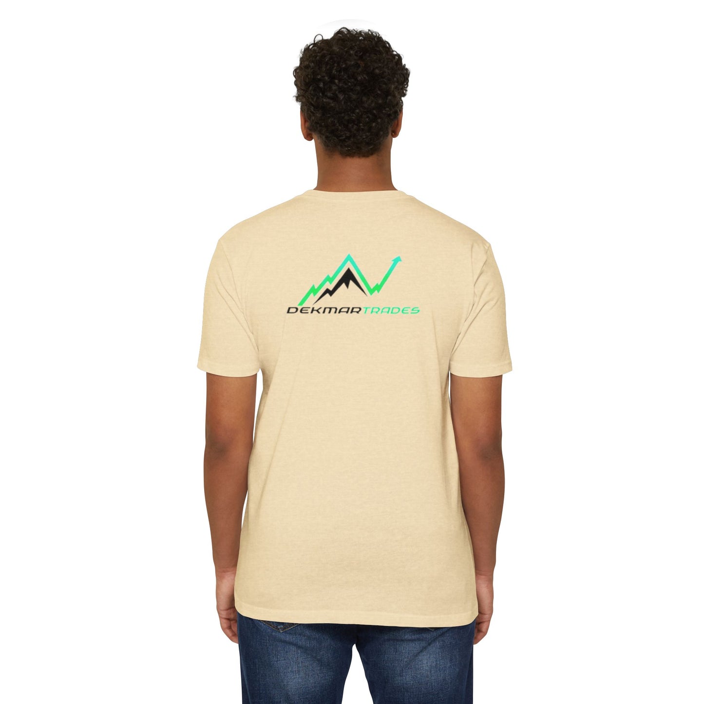 Male model back view in beige CVC t-shirt displaying "Dekmar Trades" mountain graphic, casual jeans