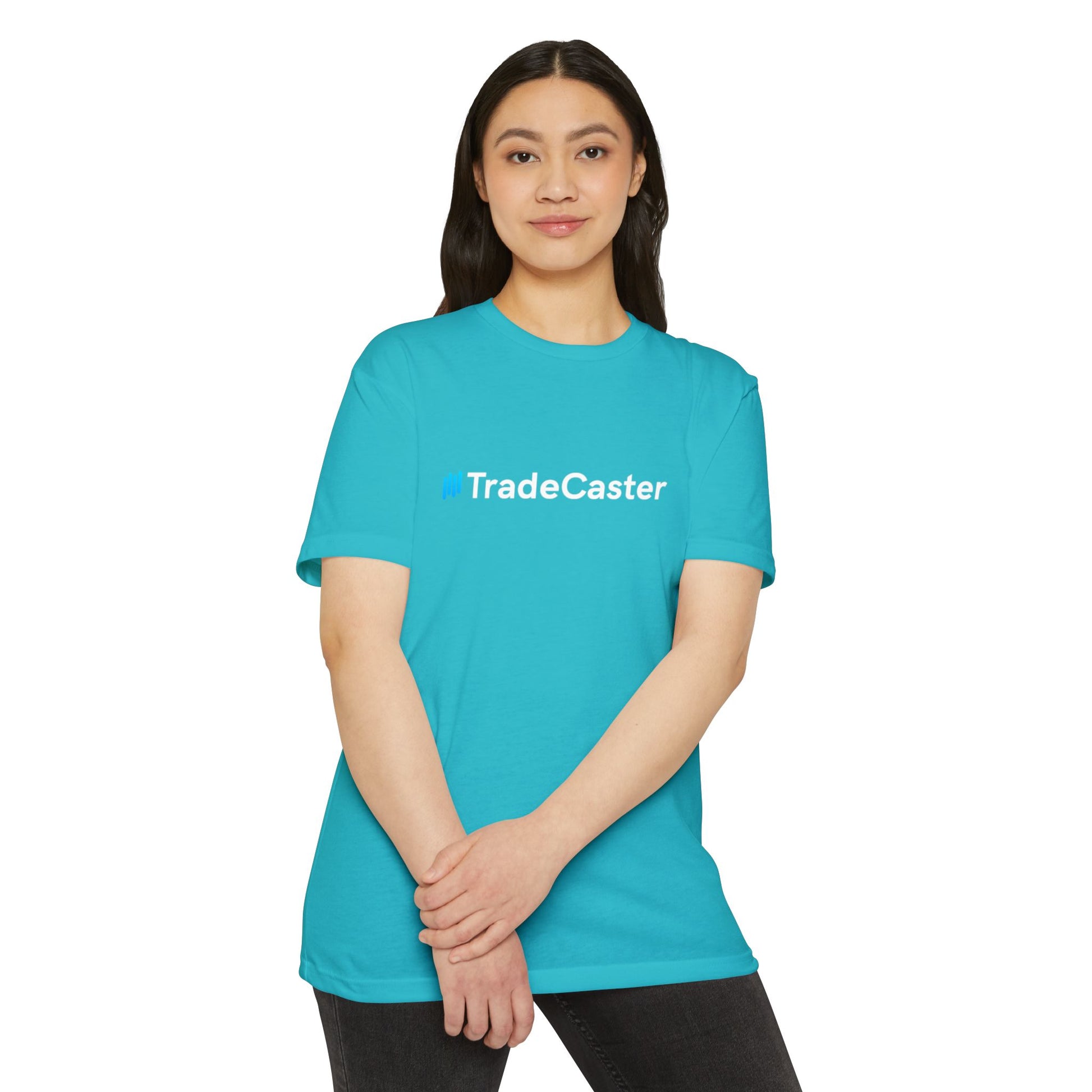 Smiling Asian woman models front of turquoise TradeCaster t-shirt, bold blue text centered on chest
