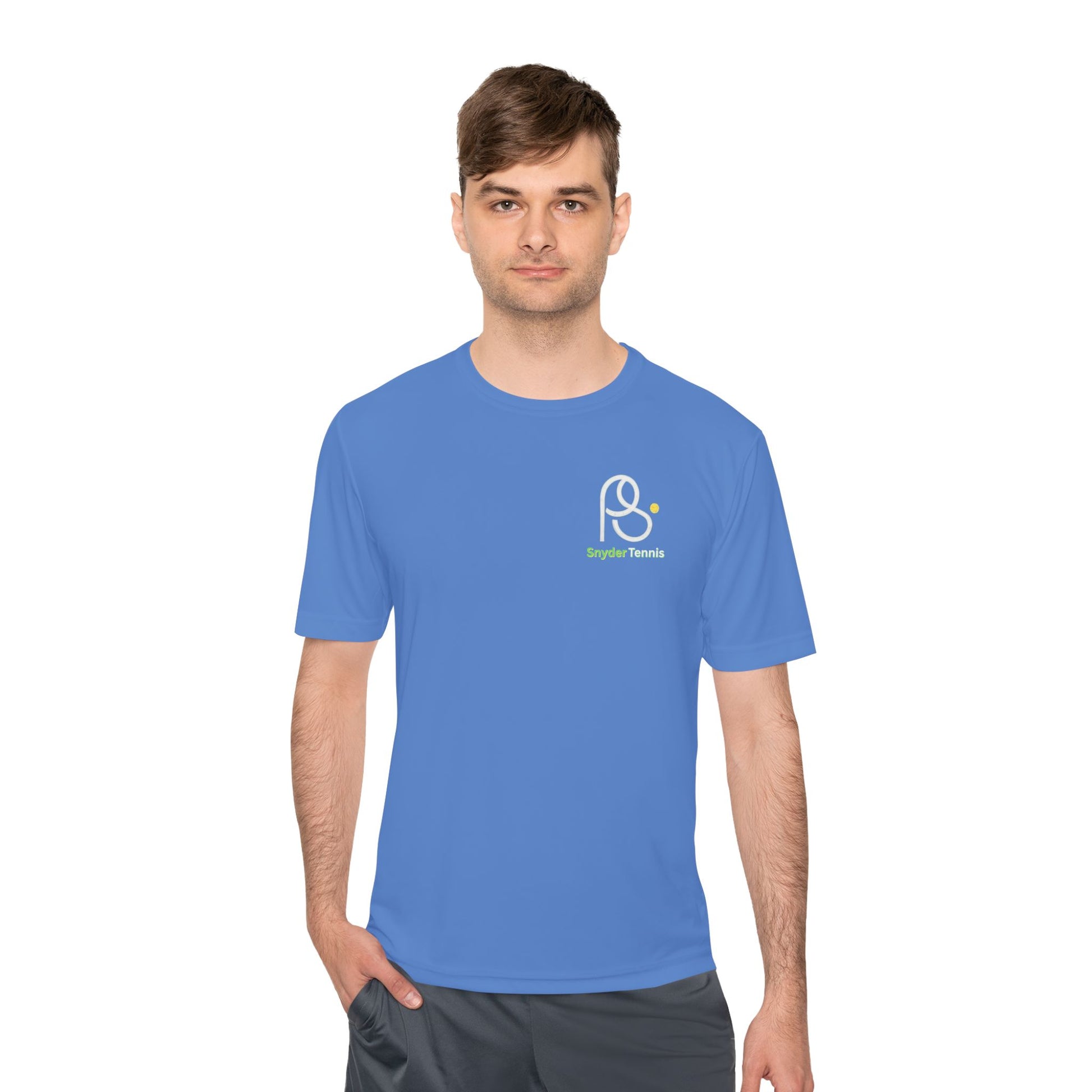 Male model in atomic blue moisture-wicking tee, crisp white PS emblem and green "Bridge Tennis"