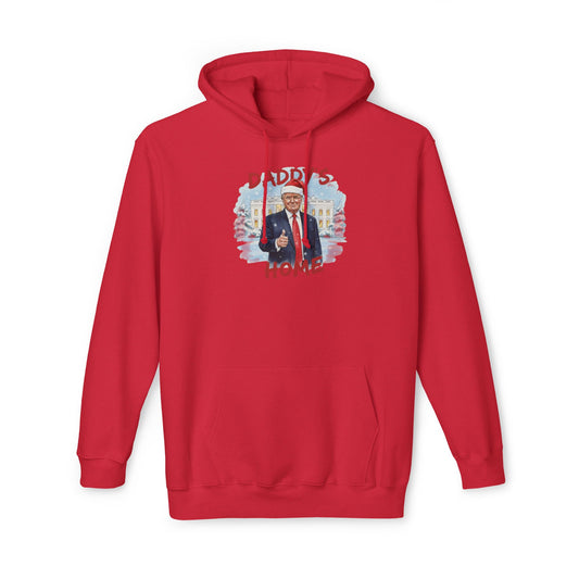 Front view of red pullover hoodie with "Daddy's Home" arched around Trump in Santa hat, thumbs up over snowy White House