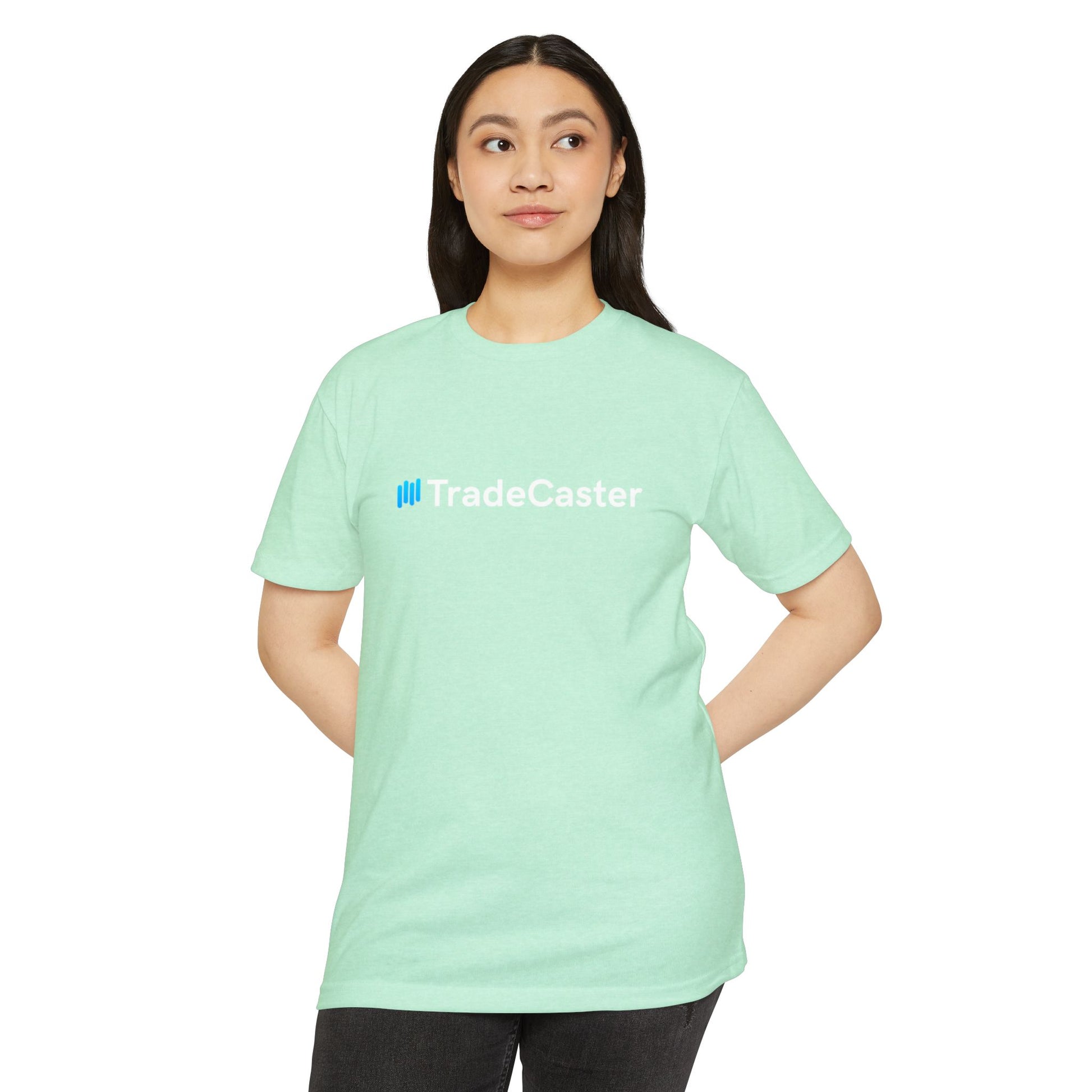 Female model front of CVC mint TradeCaster tee, cyan logo shining, hands-on-hips cool