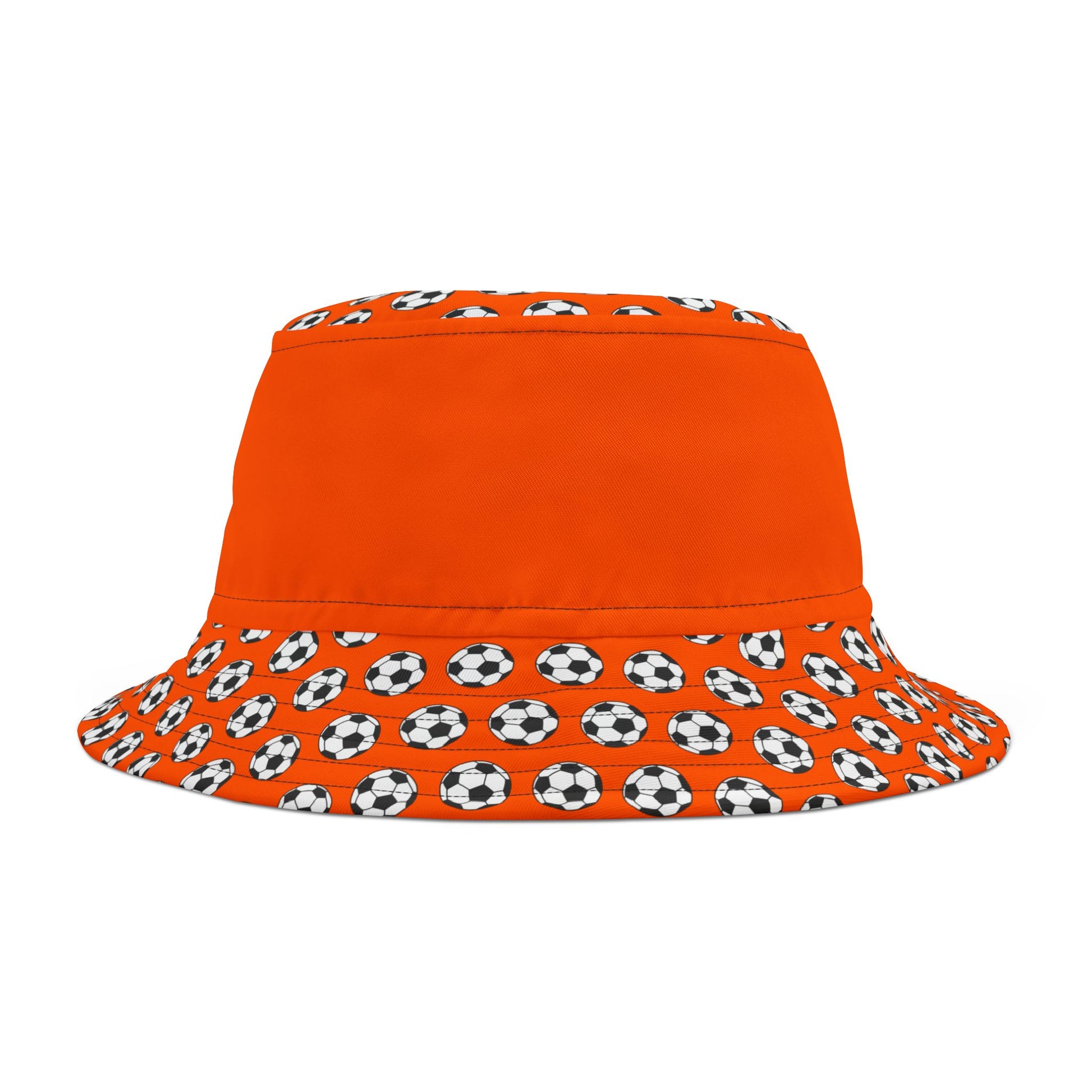 Flat lay orange bucket hat angled to show crown & wide brim of black & white soccer ball pattern