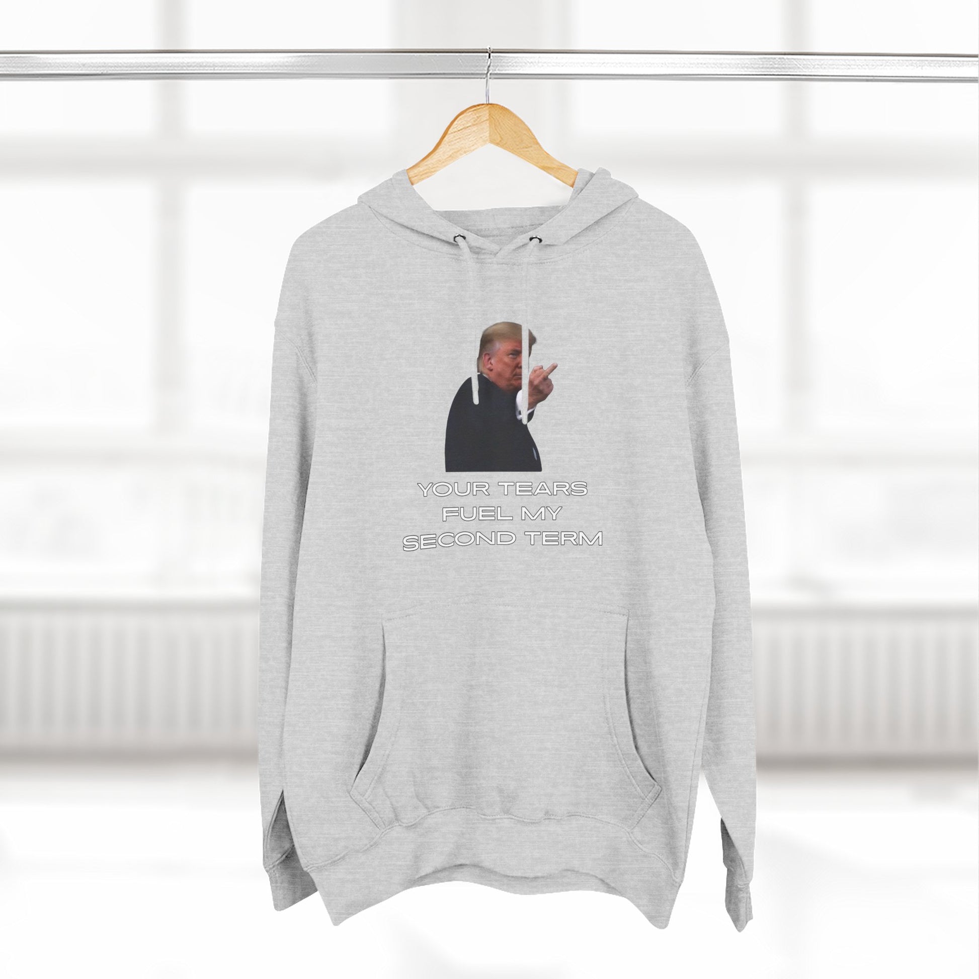 Heather grey Trump Plant Flip Off hoodie on hanger, front view of the epic gesture print