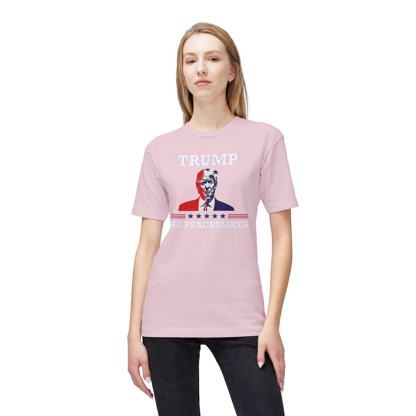 Model rocking front of light pink "TRUMP HE PEACEMAKER" tee with bold portrait graphic
