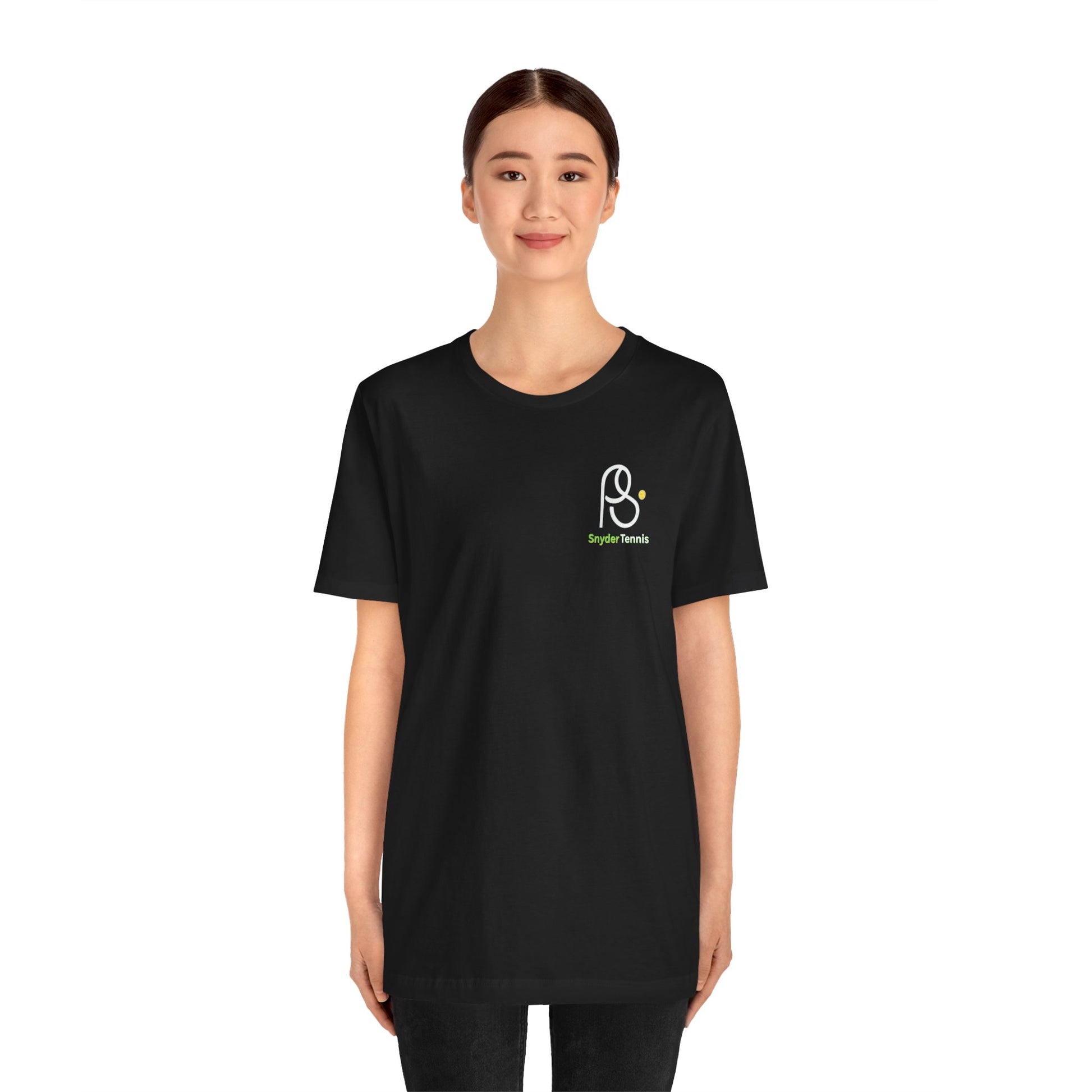 Woman in front view of black Coach Pete Snyder tee, white PS tennis logo with green "PS Tennis" detail
