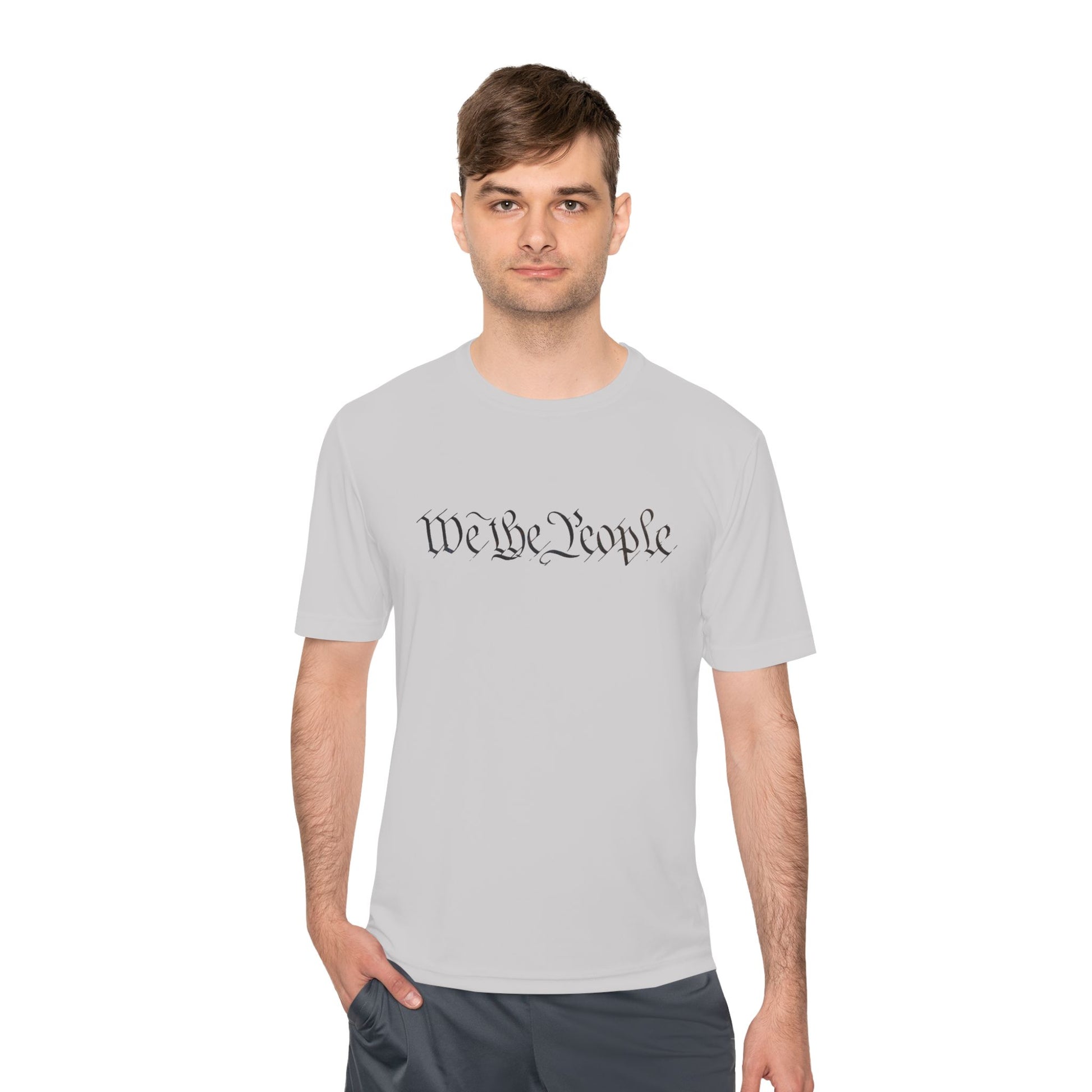 Guy modeling light grey "We the People" cursive front tee, chill workout ready