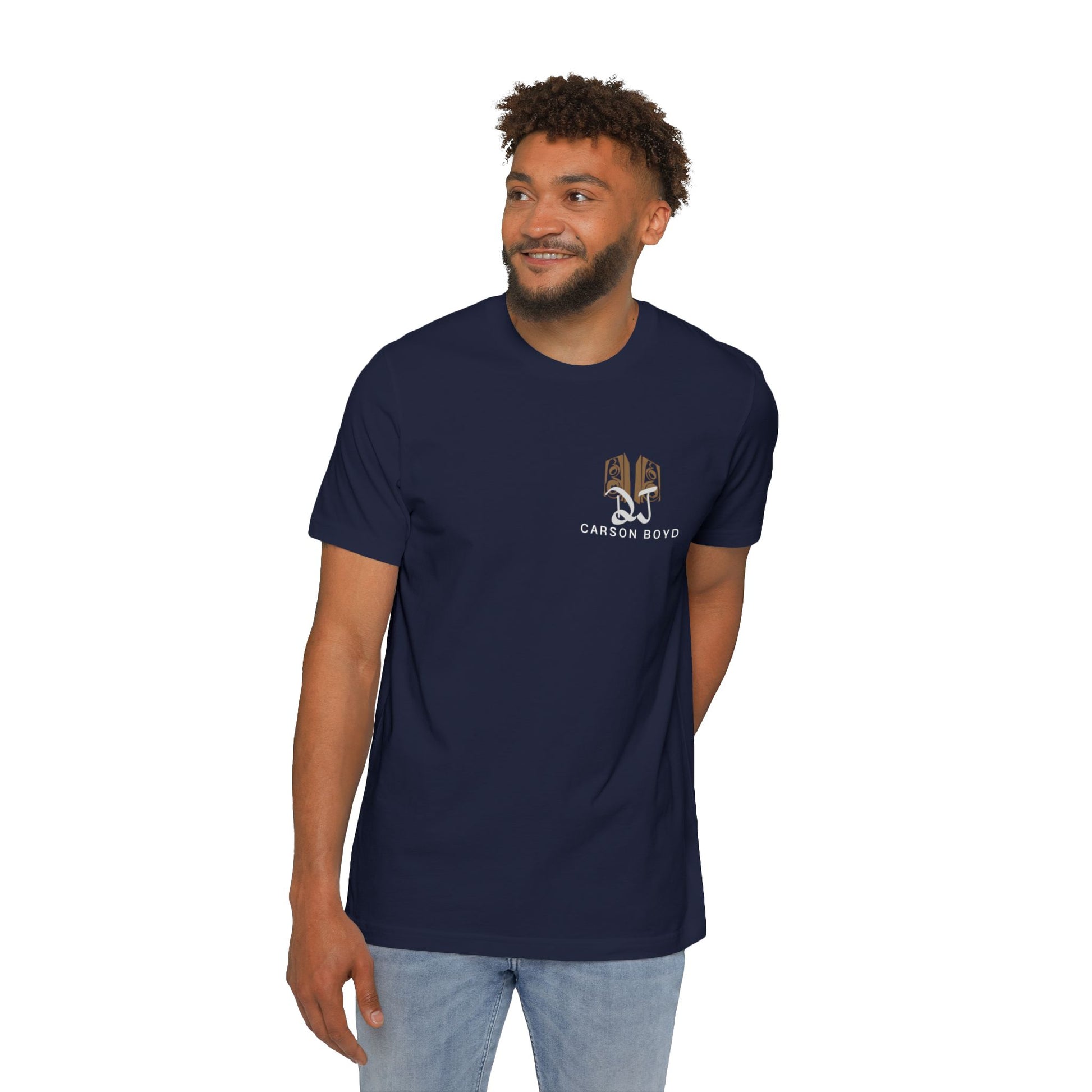 Male model standing front in navy heather tee, subtle tan DJ Carson Boyd chest graphic
