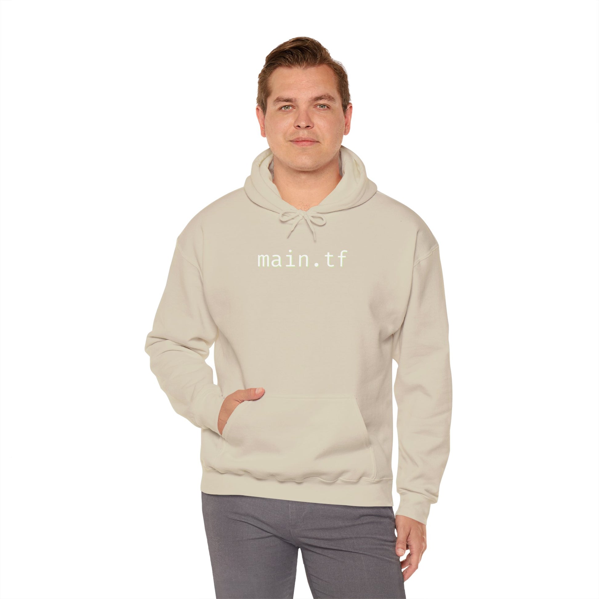Light grey main.tf hoodie front on smiling guy, hand in kangaroo pocket – stealthy DevOps vibes