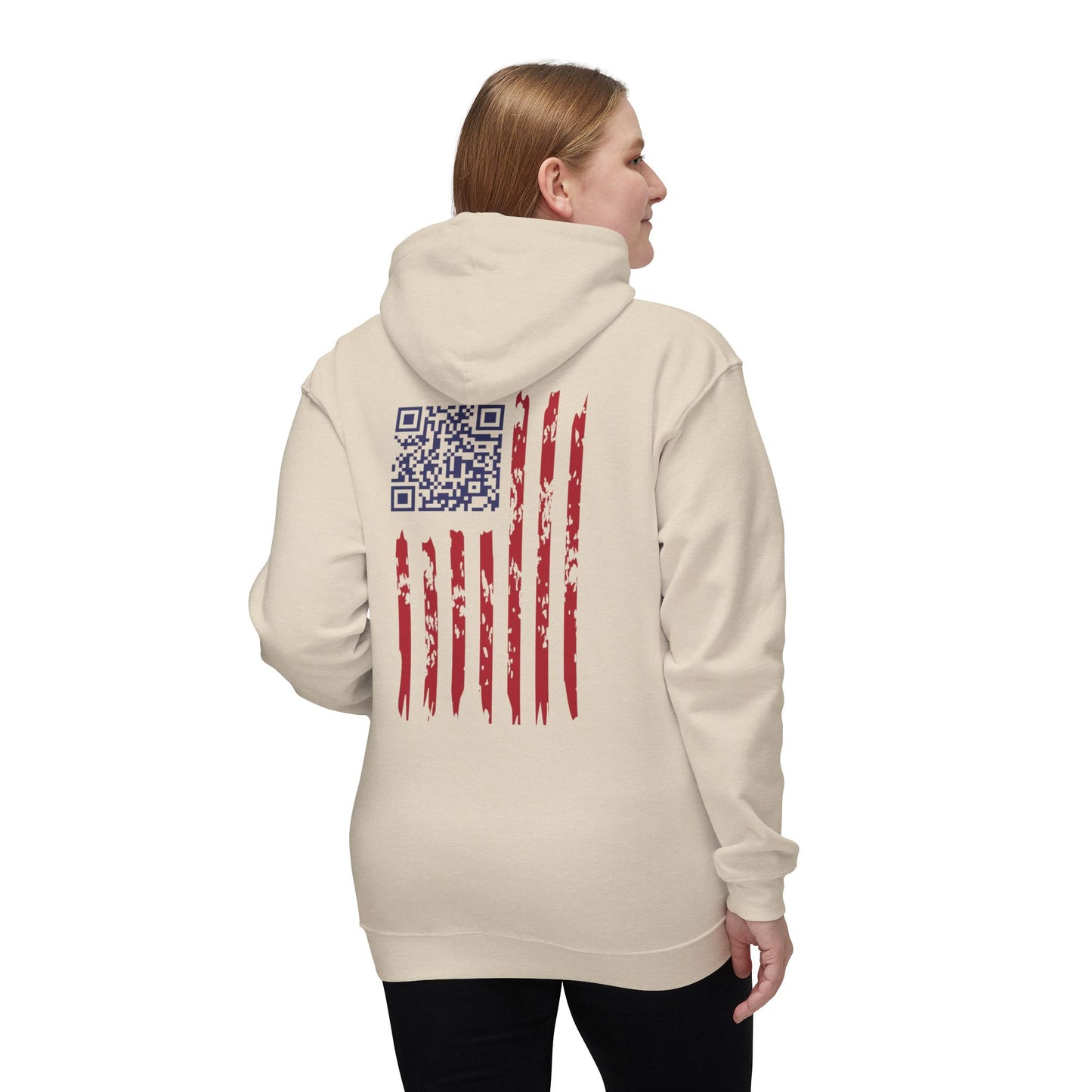 Woman showing cream hoodie back: rugged American flag design hiding Trump dance QR code