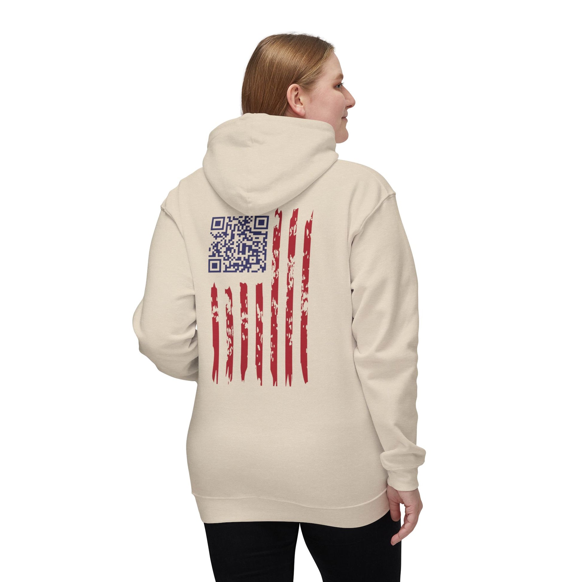 Woman showing cream hoodie back: rugged American flag design hiding Trump dance QR code