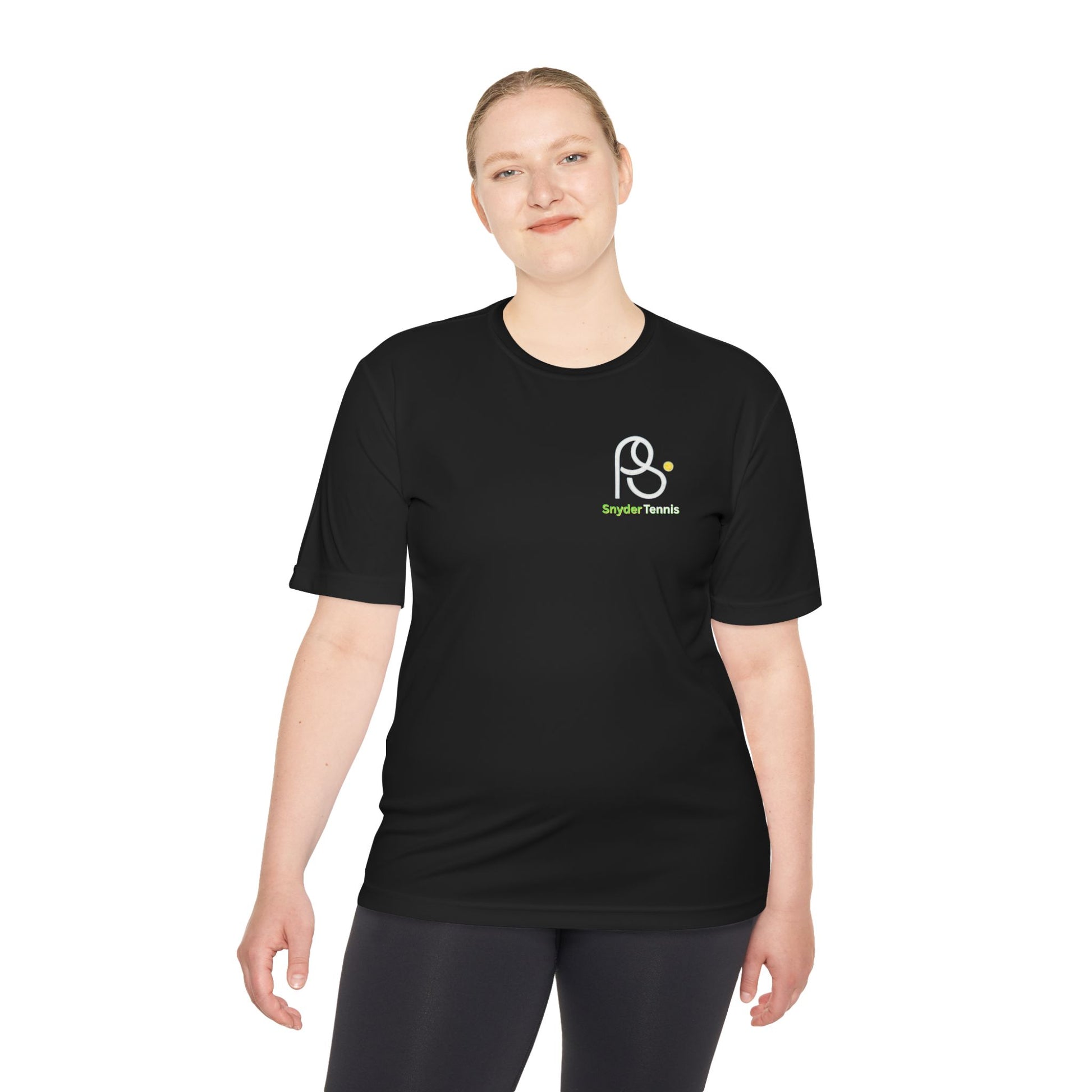 Smiling woman models front of black moisture-wicking tee with white-outlined PS logo and green Bryant Tennis on chest