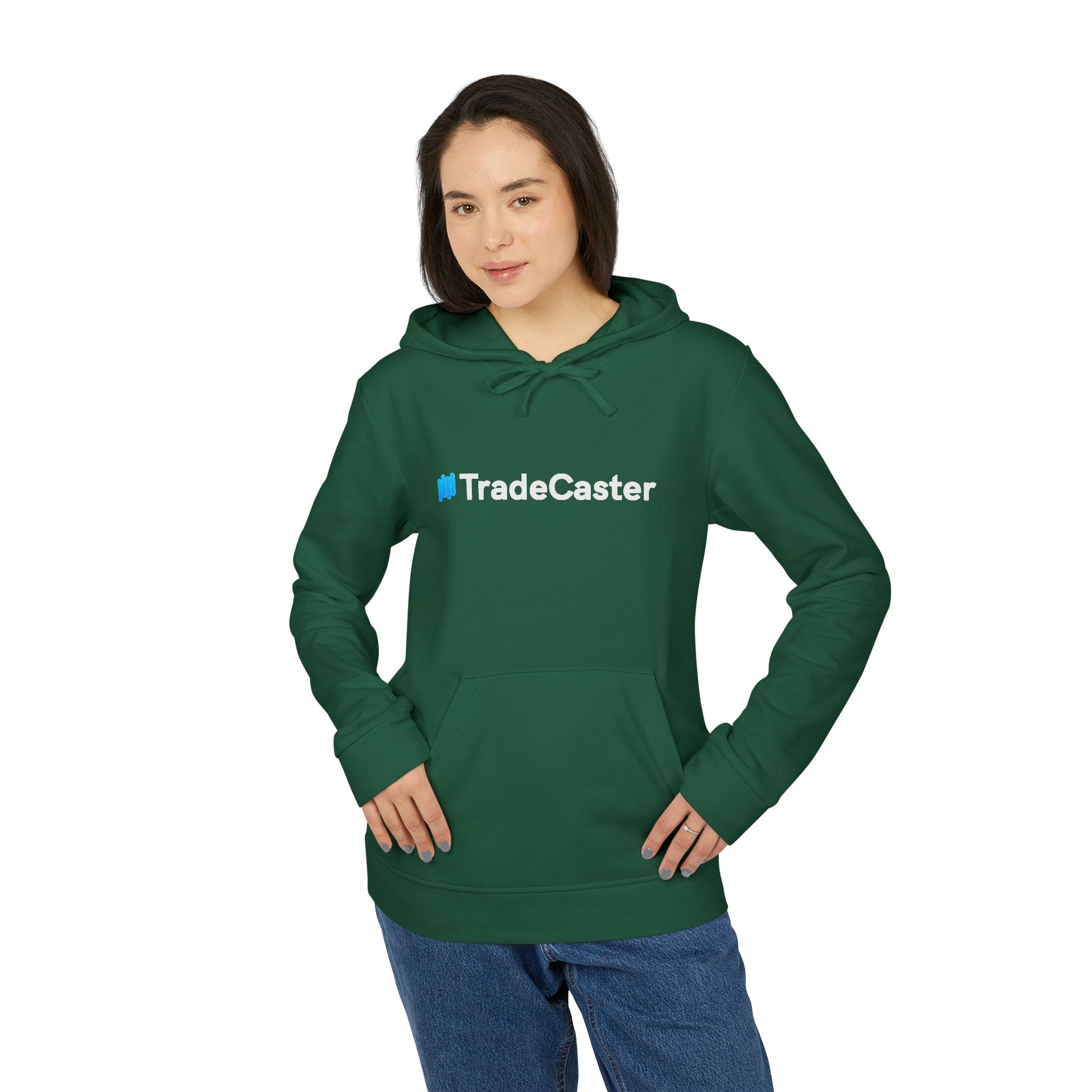 Woman fronts green TradeCaster Adidas hoodie, bold white-blue logo over pocket, casual jeans style