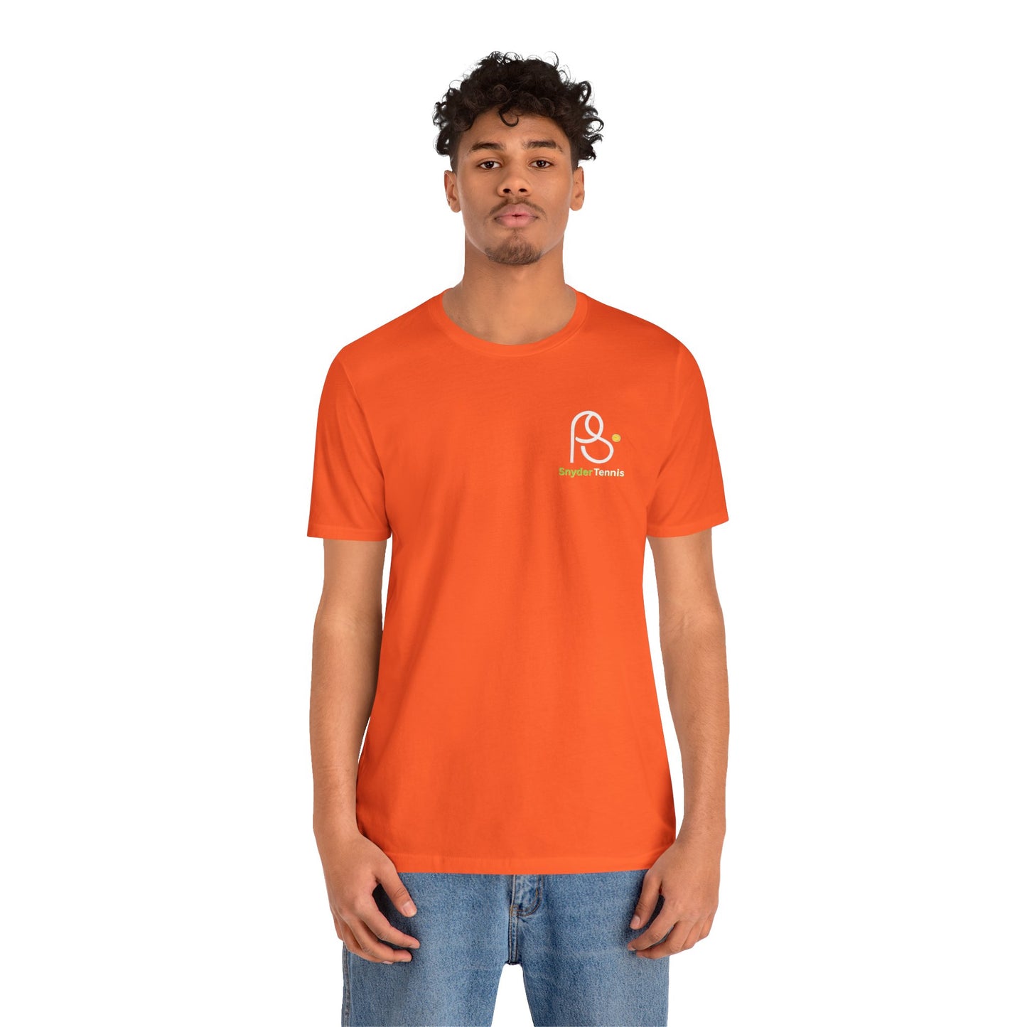 Smiling woman model in orange Coach Pete Snyder tee, crisp white PS Harrison Tennis logo left chest