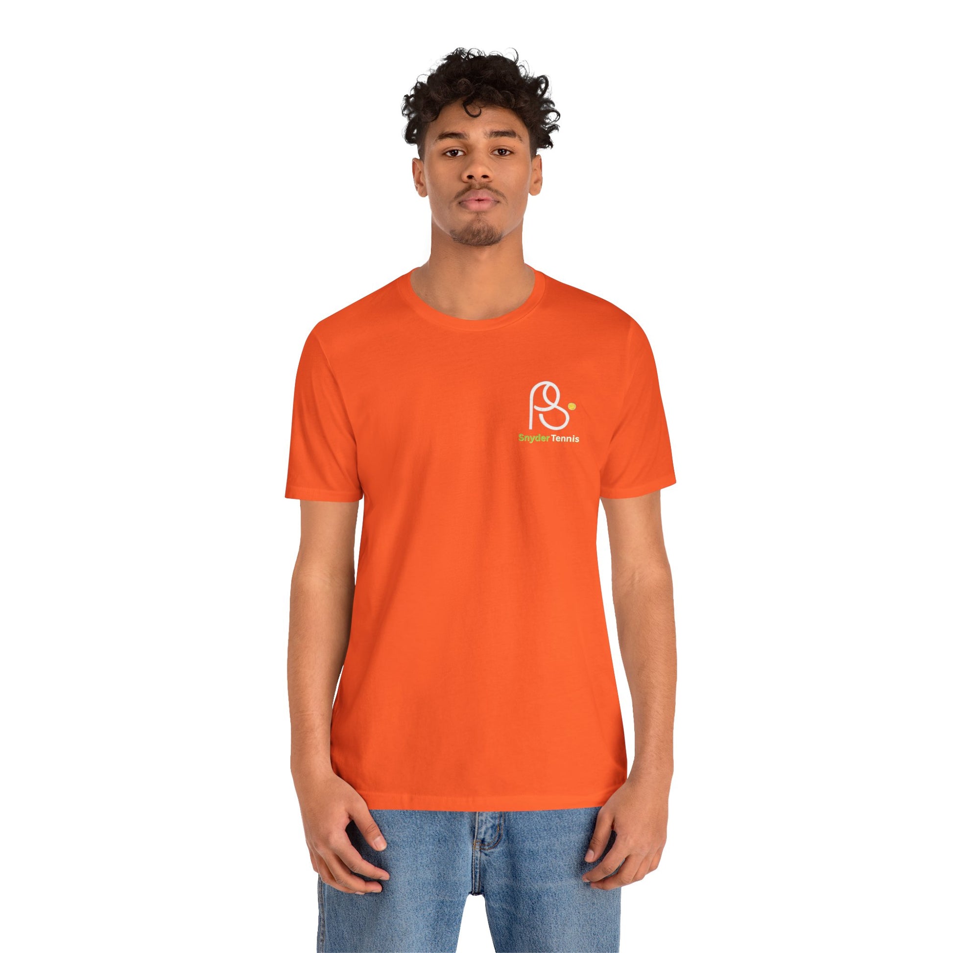 Smiling woman model in orange Coach Pete Snyder tee, crisp white PS Harrison Tennis logo left chest