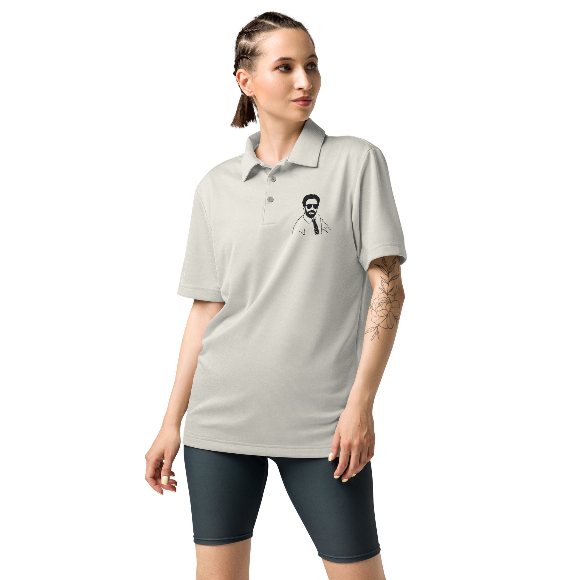 Braided model rocking light grey heather Adidas Burry polo from side, tattoo detail, black shorts