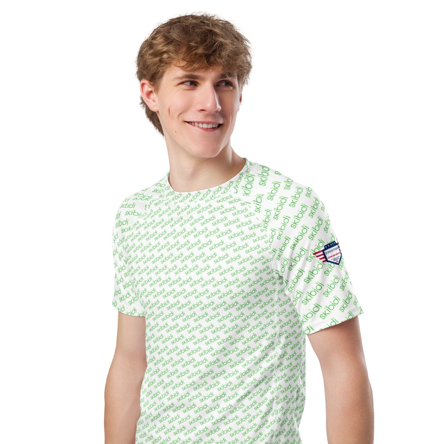 Front 3/4 view of grinning model wearing white green "skibidi" print rash guard, USA flag sleeve patch, black shorts
