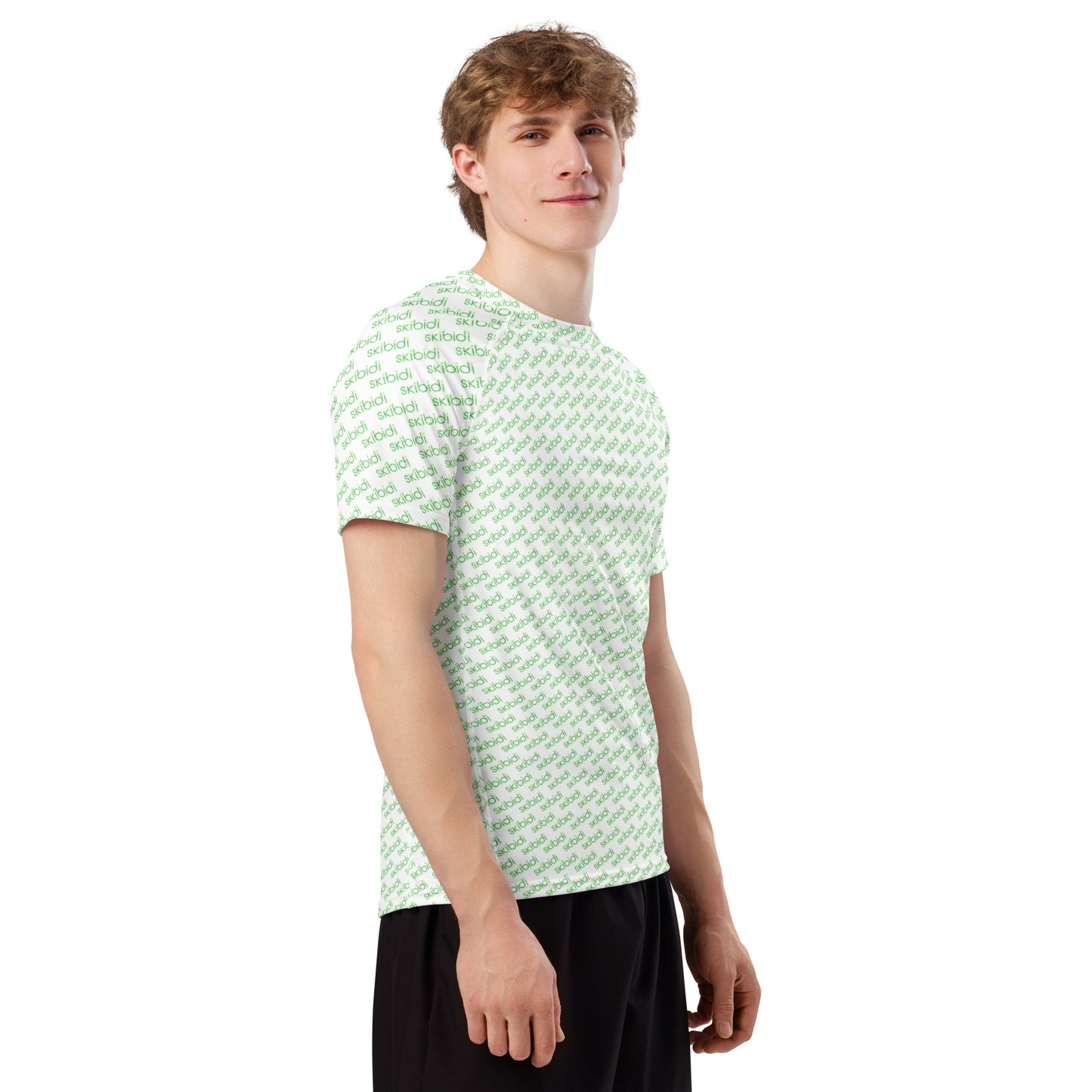 Side profile of smiling model in white skibidi all-over print rash guard with green text and black shorts