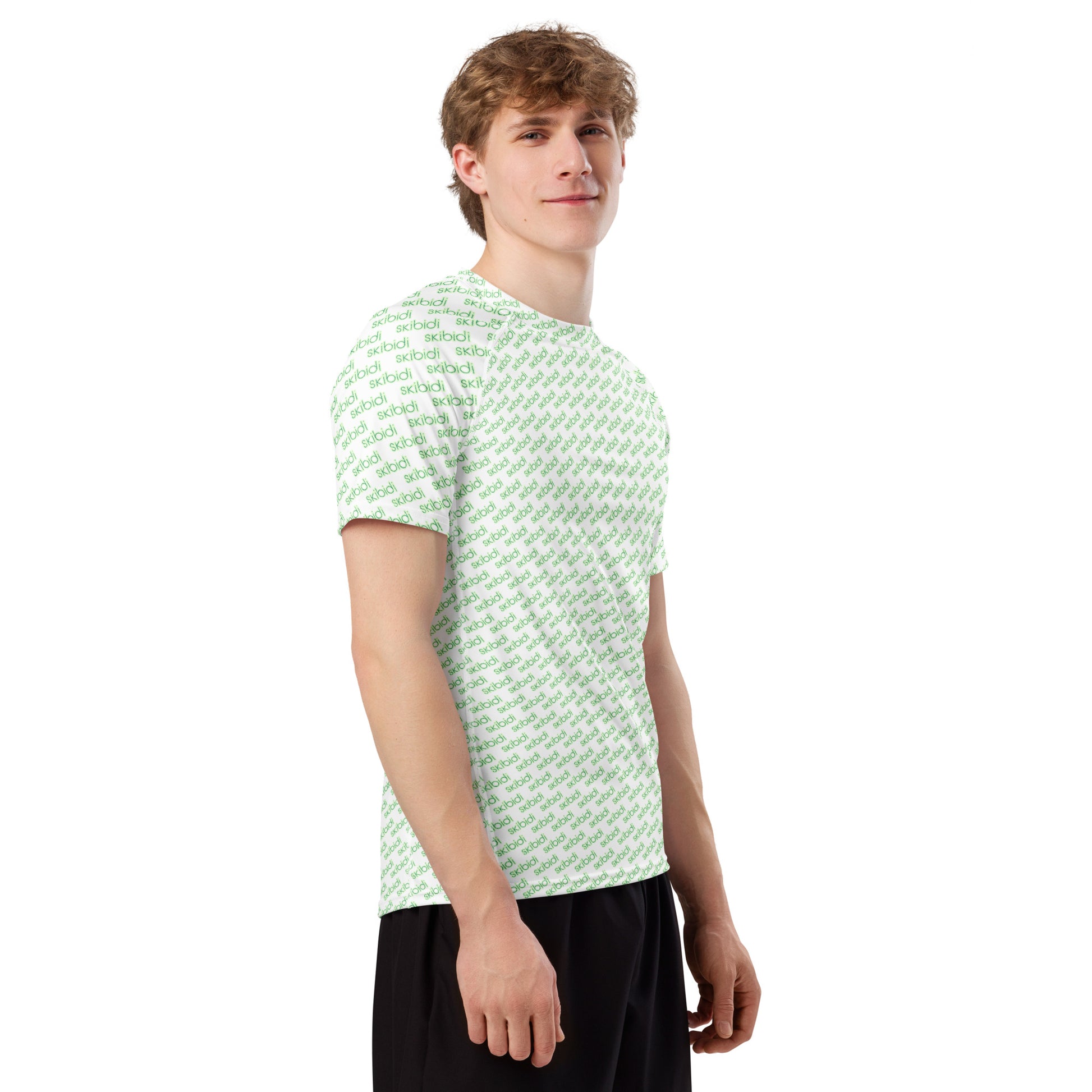Side profile of smiling model in white skibidi all-over print rash guard with green text and black shorts