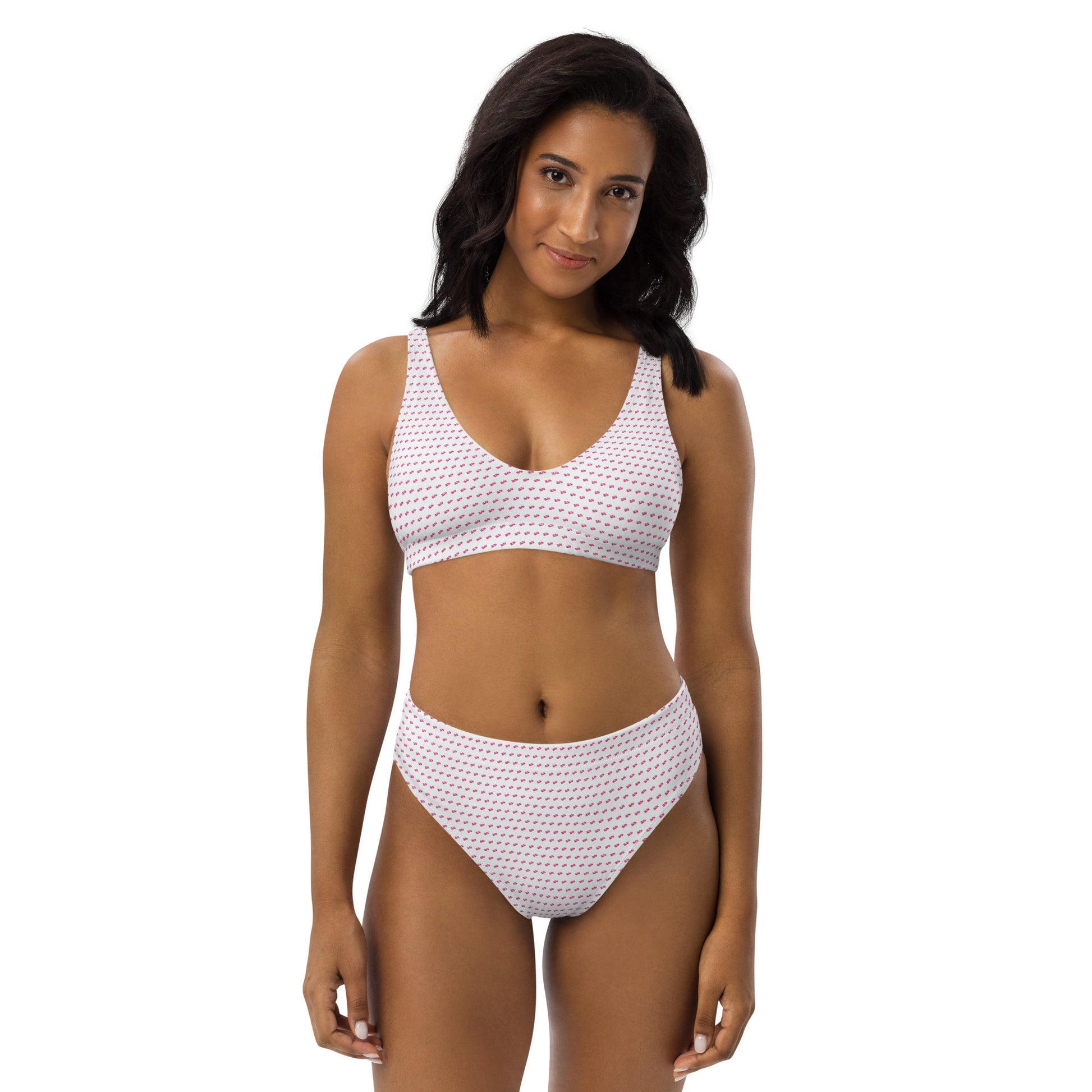 Curly-haired model front-facing in slay high-waisted bikini, white base pink geometric print