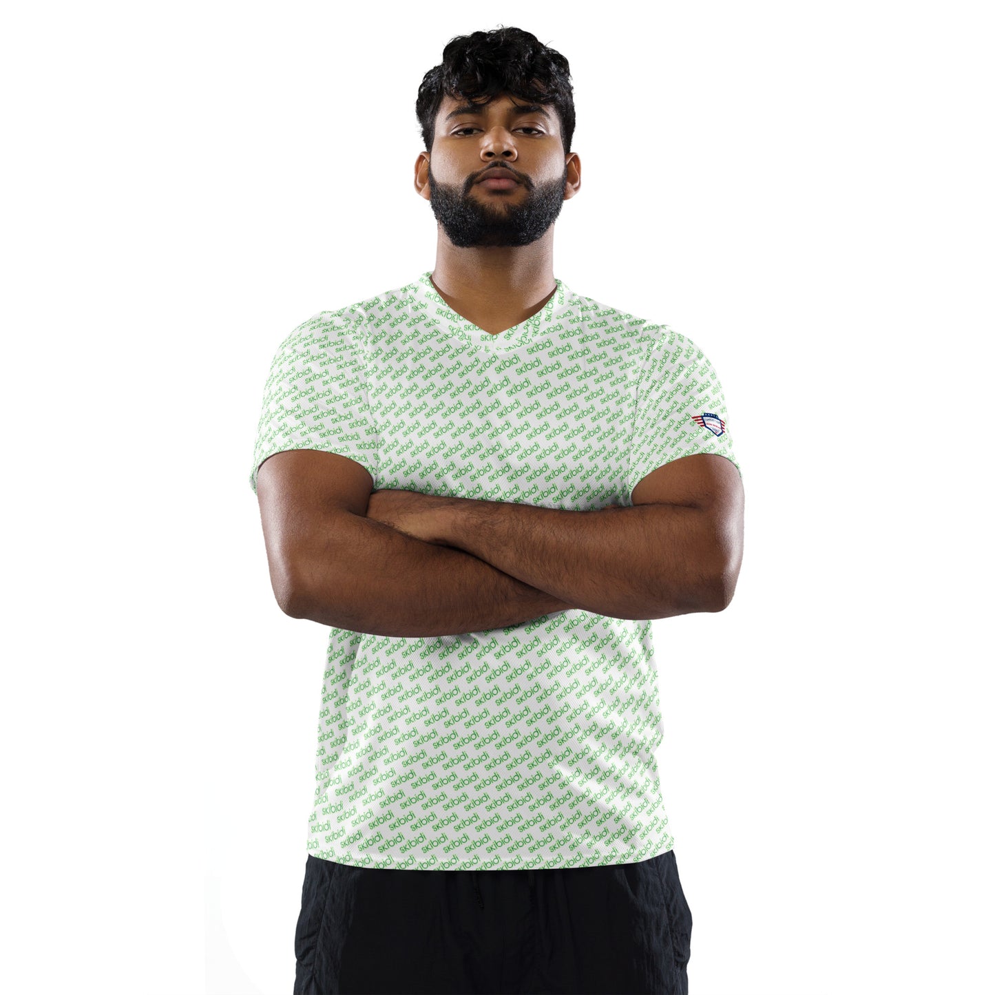 Male model with beard rocking front view of white "skibidi" print sports jersey, arms crossed, black shorts