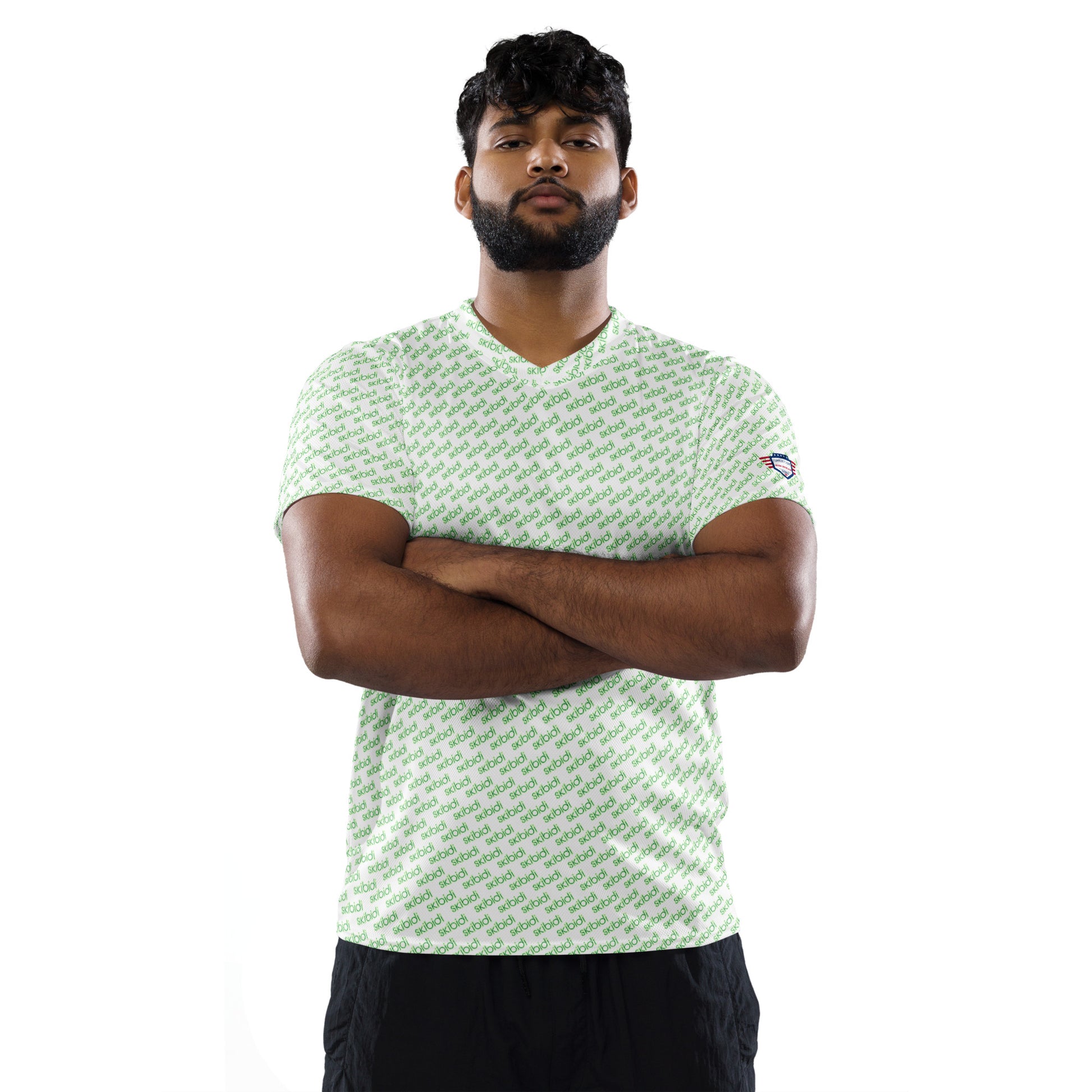Male model with beard rocking front view of white "skibidi" print sports jersey, arms crossed, black shorts