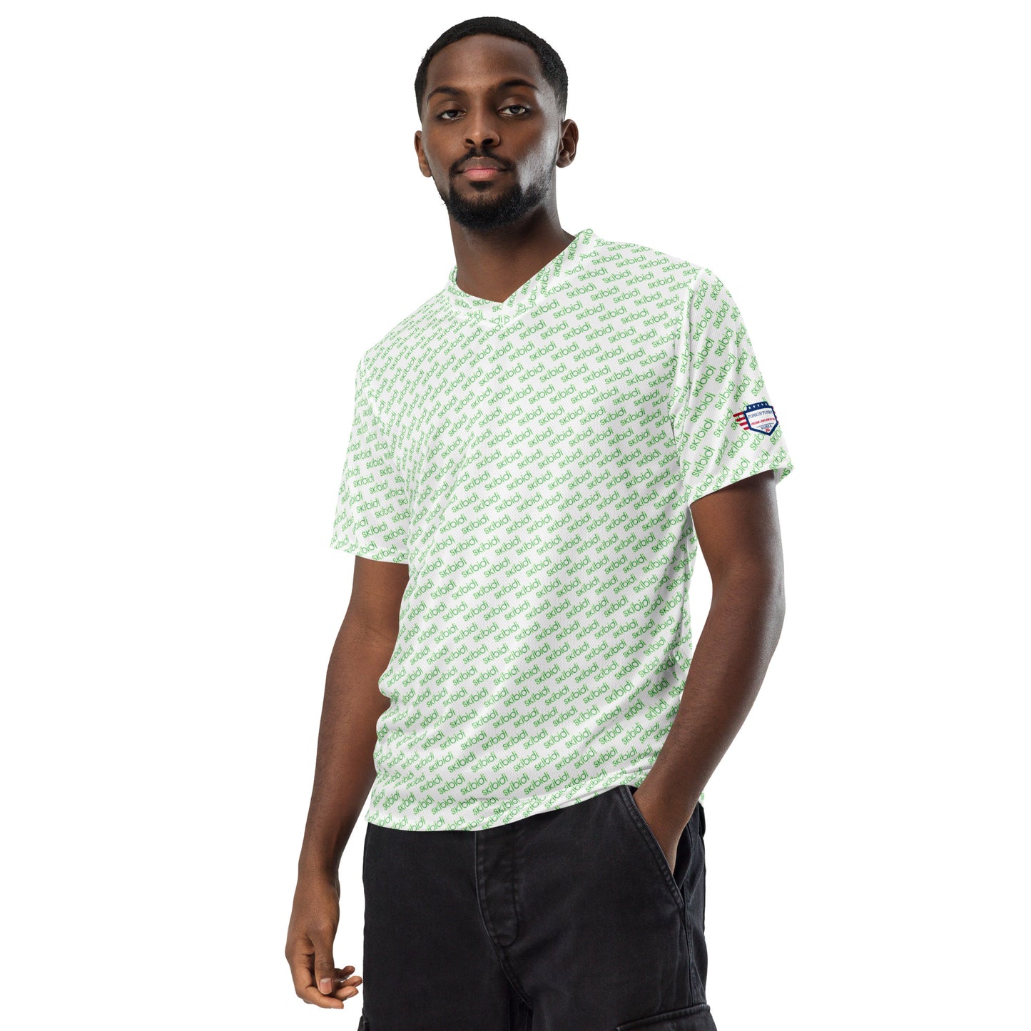 Male model hands-in-pockets front view wearing white "skibidi" pattern sports jersey, black pants
