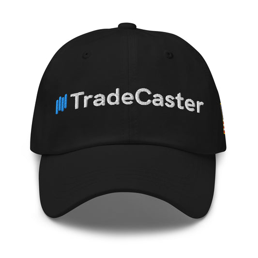 Front view of black unstructured cap with blue bars and white "TradeCaster" embroidery across the crown