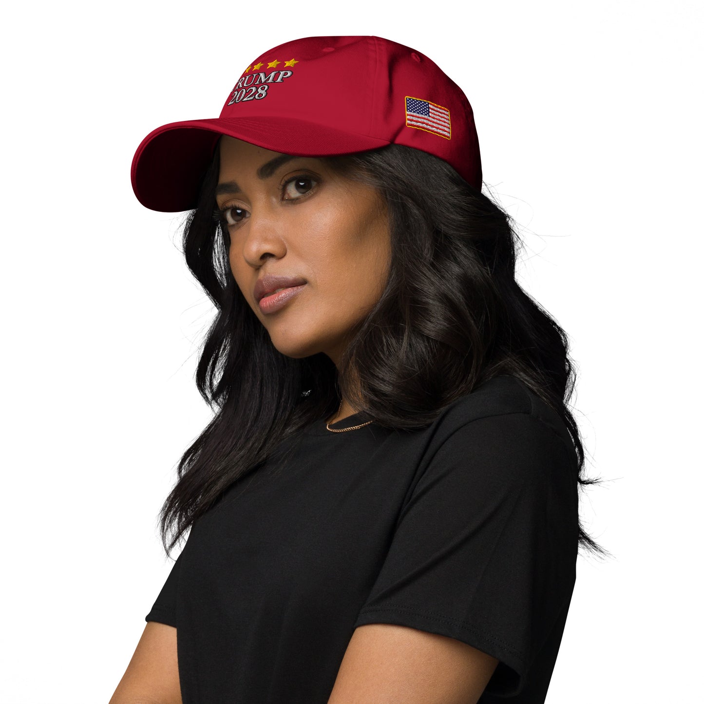 Side profile of woman in black top wearing red "Trump 2028" hat with stars and flag visible