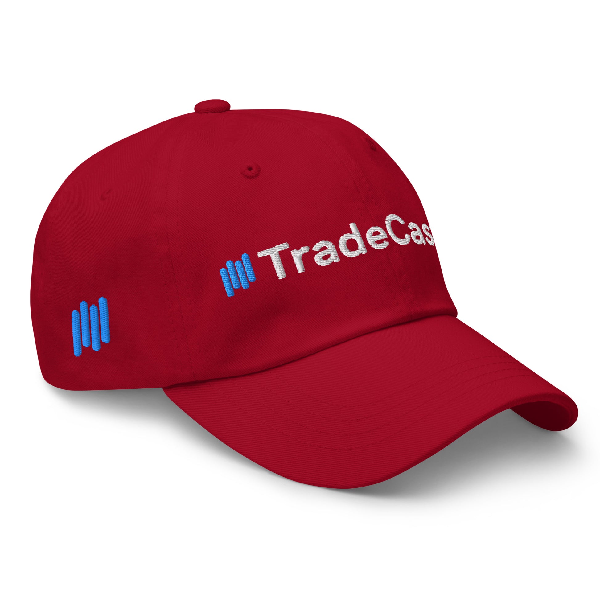 Left side angle of cranberry red TradeCaster hat with "||TradeCas" white embroidery and blue bars
