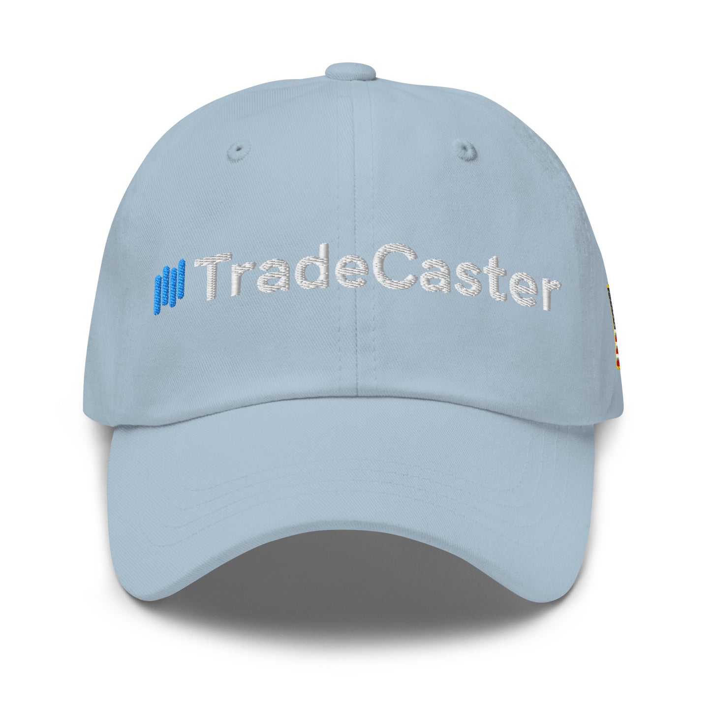 Front view of light blue unstructured dad hat with white "||TradeCaster" embroidery, blue bars adding trader flair
