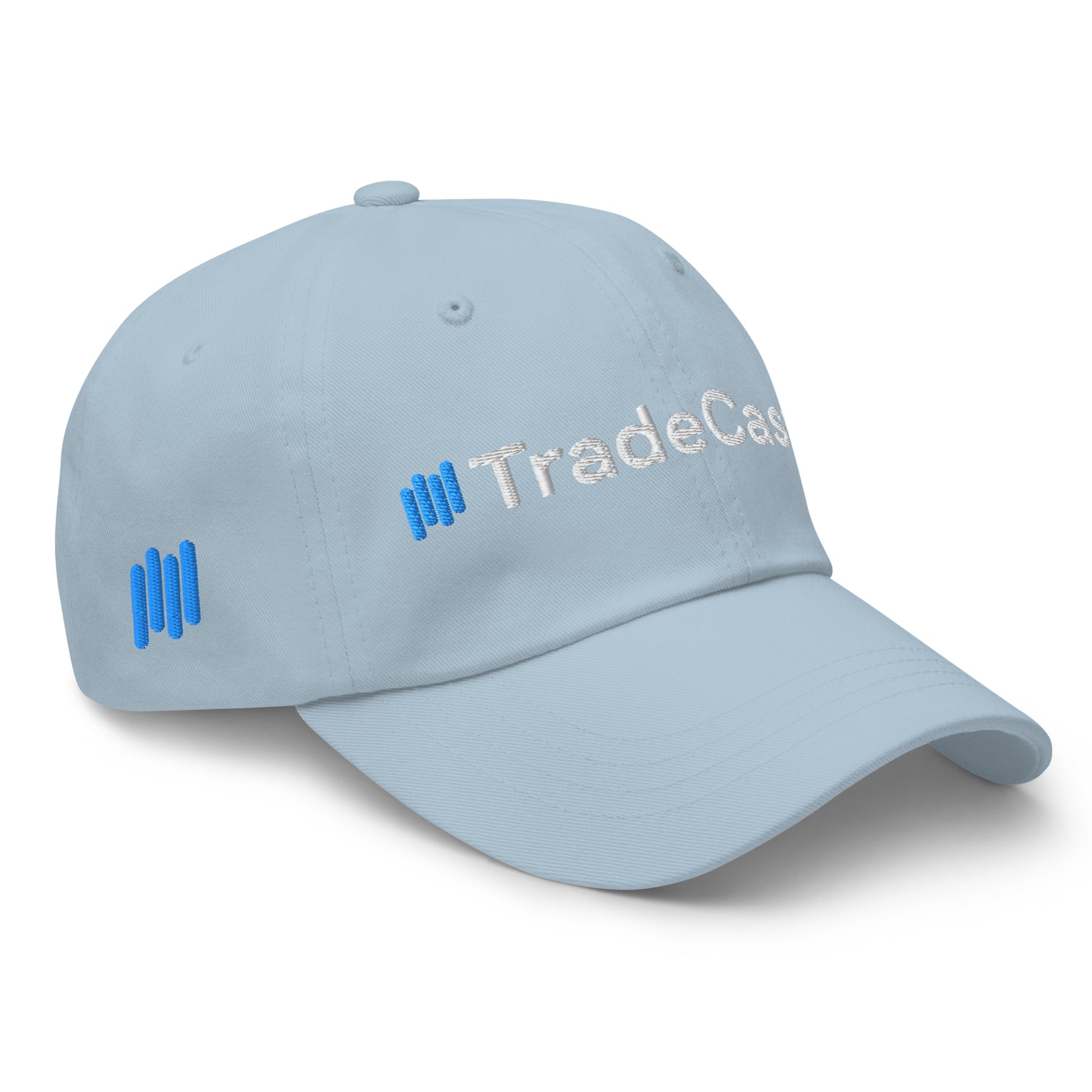 Left side angle of light blue dad hat with "TradeCas" white embroidery and blue bars peeking