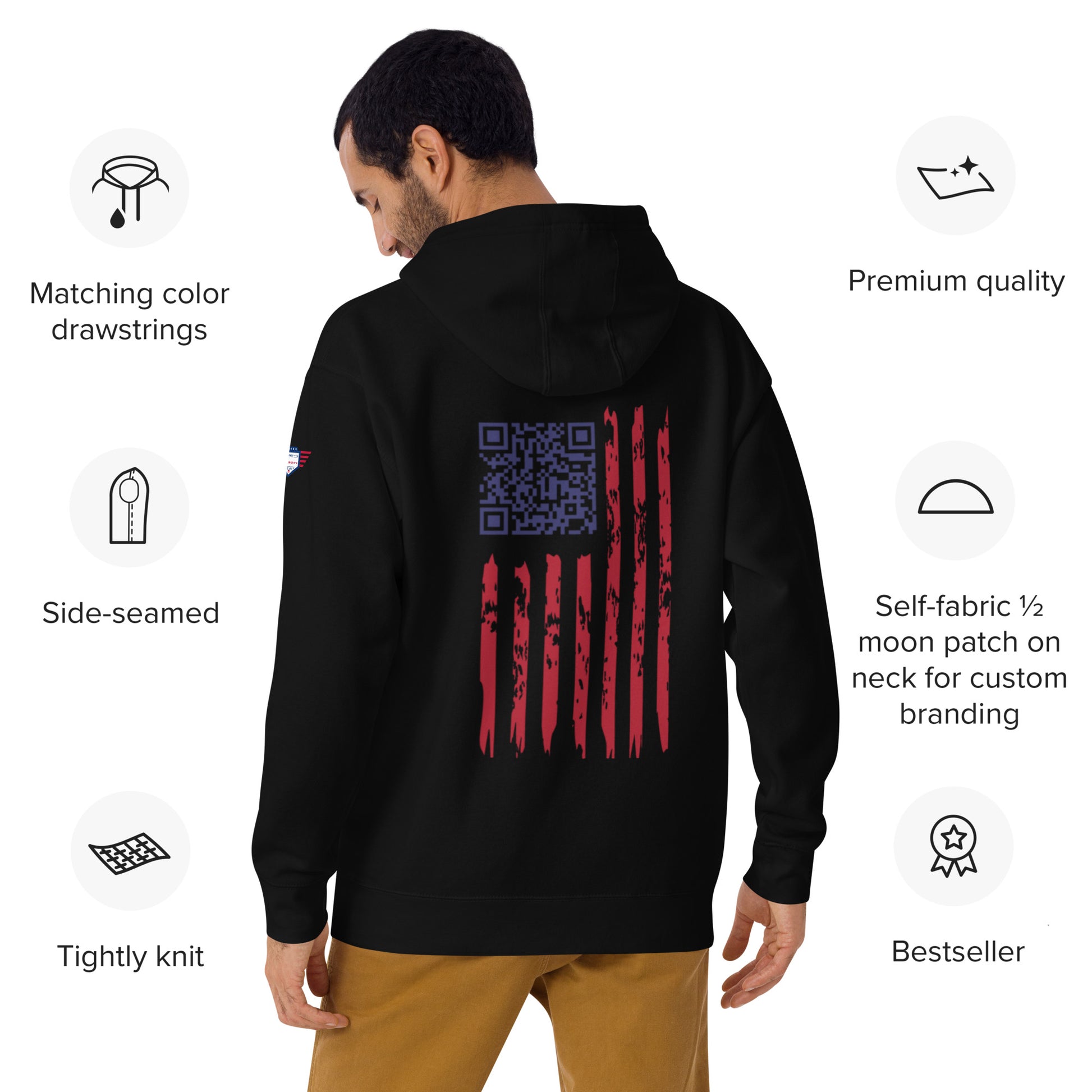 Back view of man in black hoodie showing Trump dance QR code over distressed USA flag stripes and feature badges
