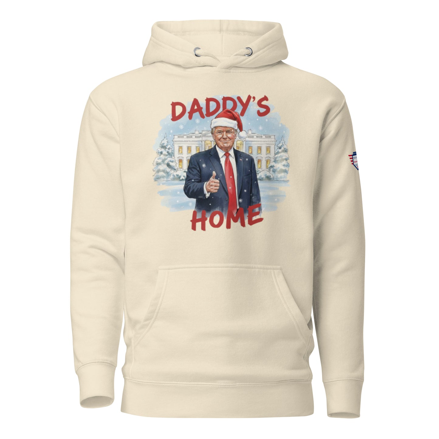 Front view of cream "Daddy’s Home" hoodie: Santa Trump thumbs-up at snowy White House with flag patch