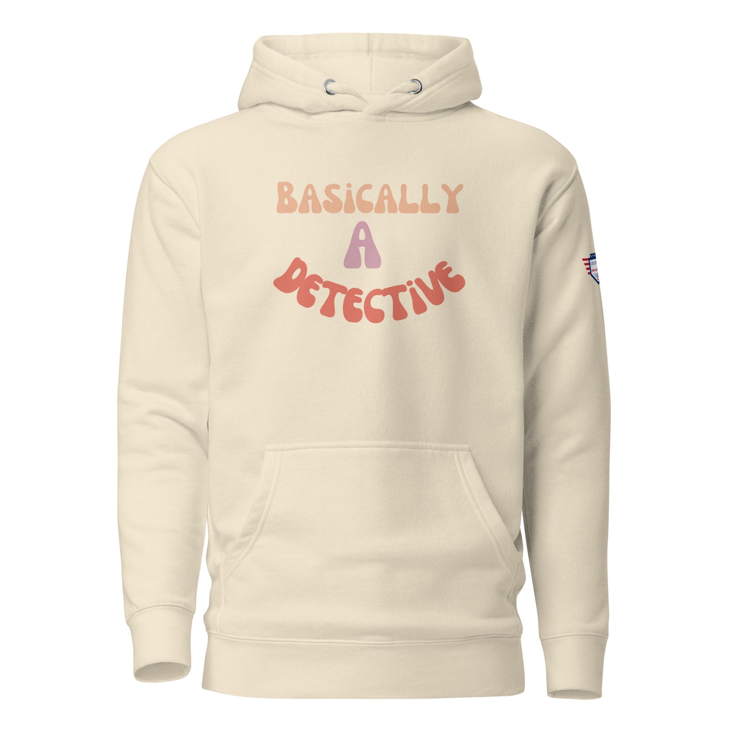 Front view of cream unisex hoodie boasting "Basically a Detective" in groovy orange-pink-red font